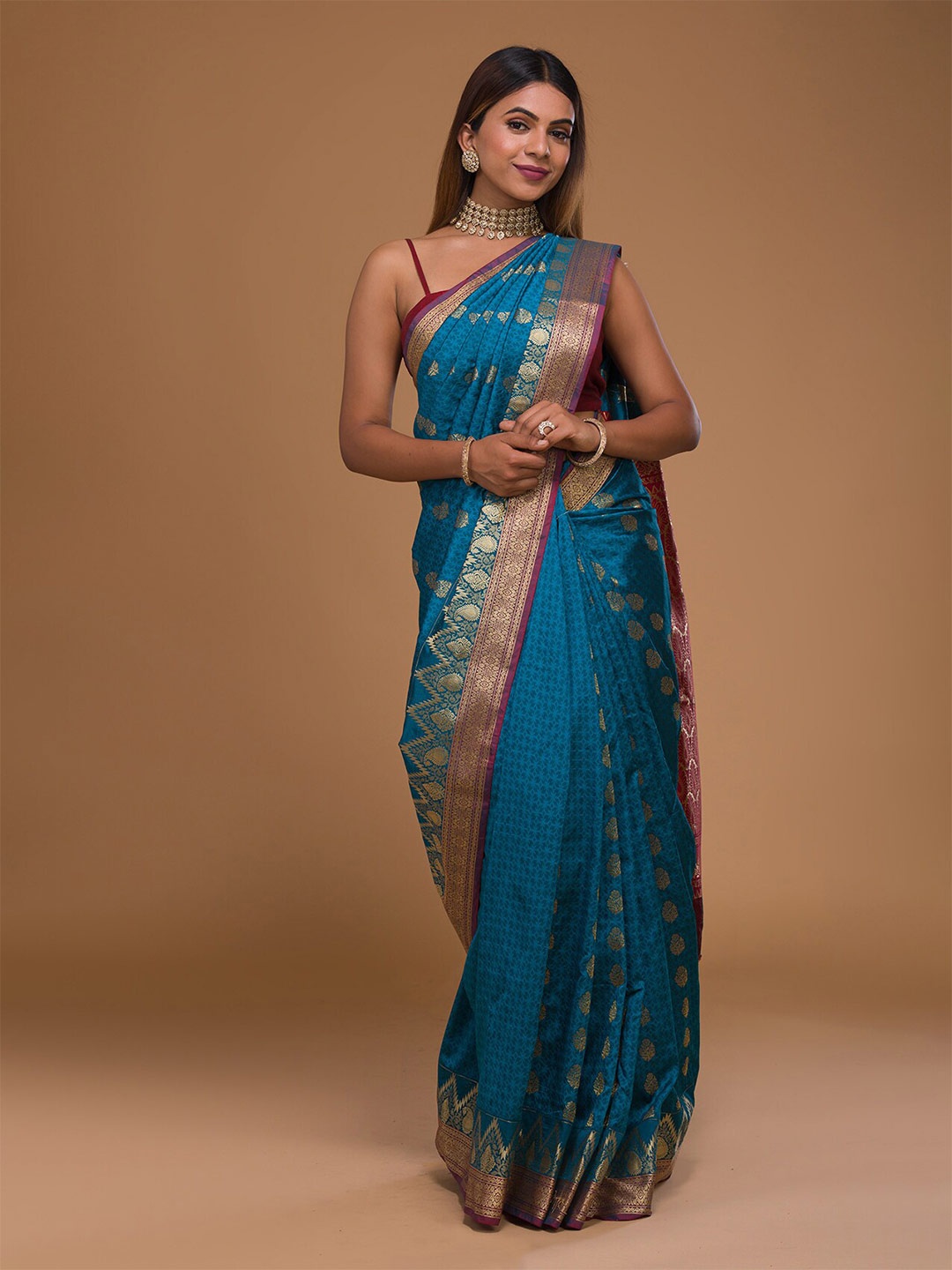 

Koskii Turquoise Blue & Red Woven Design Zari Art Silk Banarasi Saree