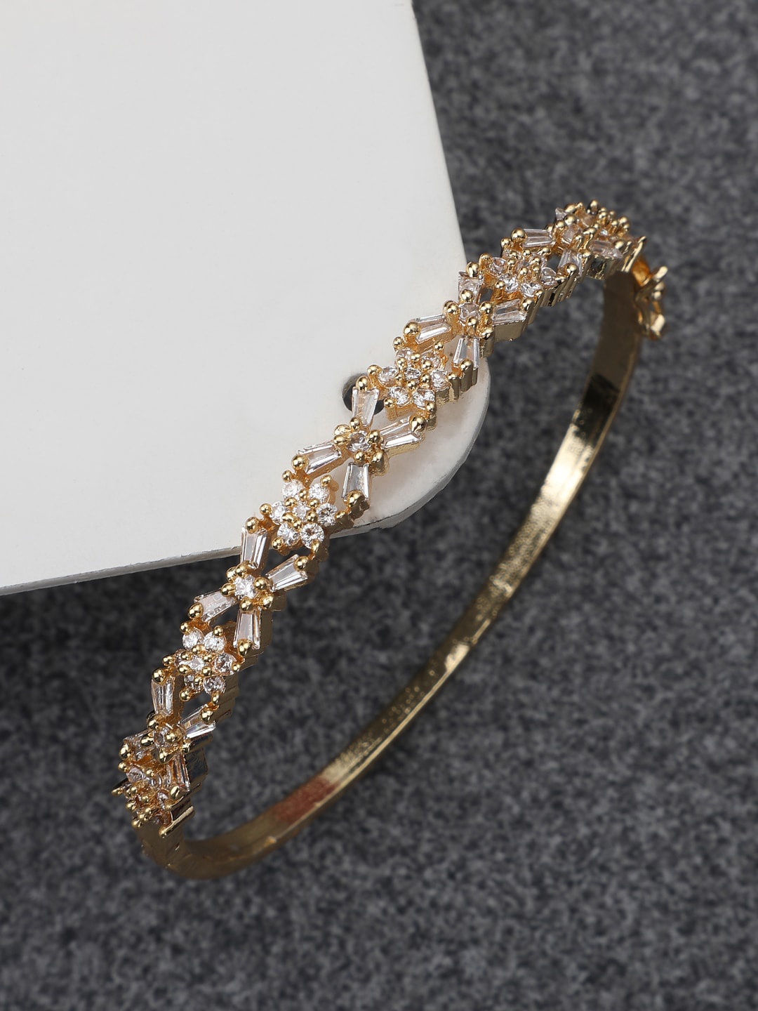 

Bhana Fashion Women Gold-Toned & White Brass American Diamond Gold-Plated Bangle-Style Bracelet