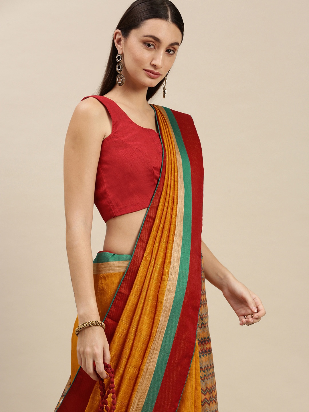 

RACHNA Mustard & Red Printed Ethnic Motifs Saree
