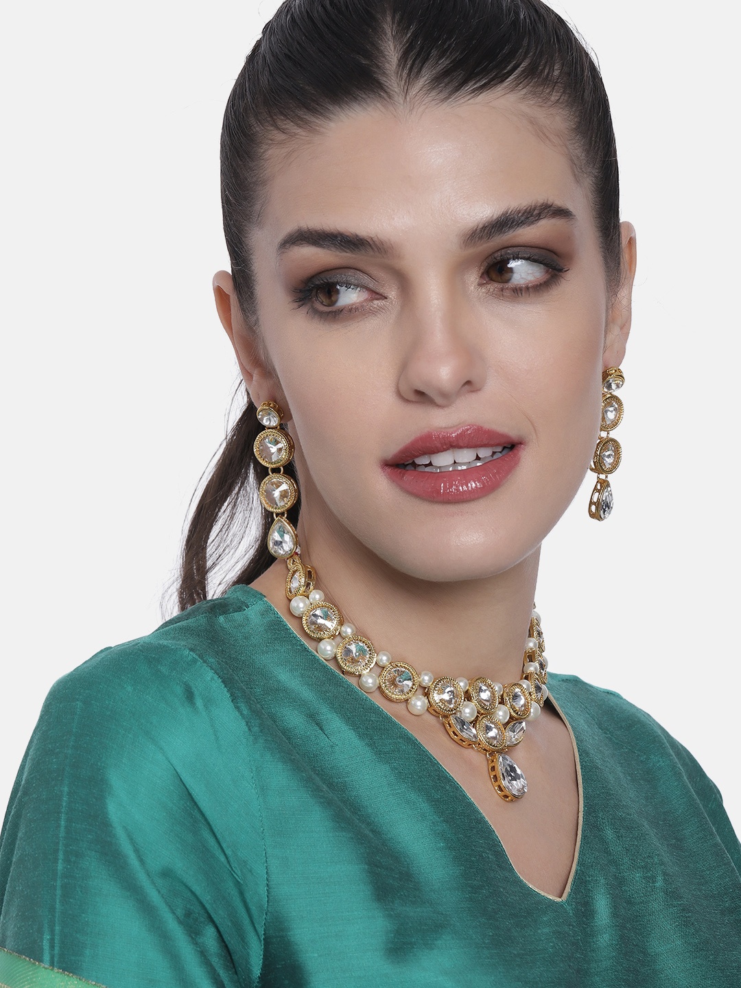 

Peora Golden & White Crystal Stone Studded Gold-Plated Traditional Jewellery Set