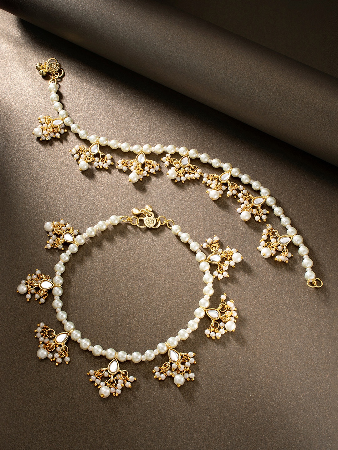 

Peora Set Of 2 White & Golden Plated Kundan Studded Pearl Bridal Anklet