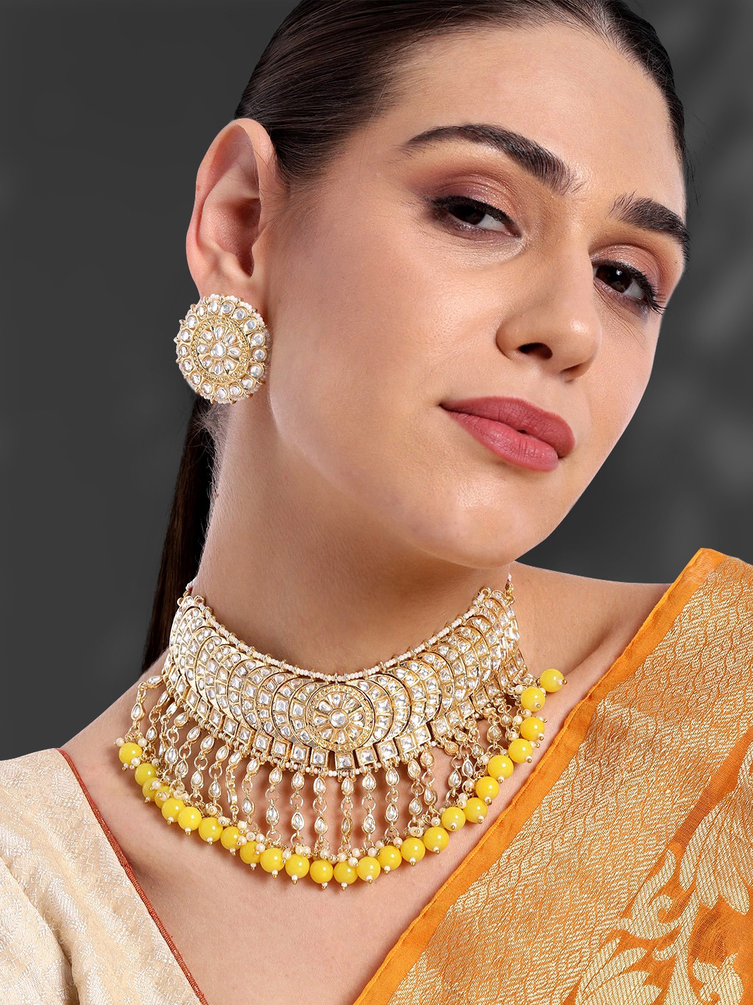 

Peora Gold-Plated & Yellow Pearl Beaded Kundan Studded Jewellery Set