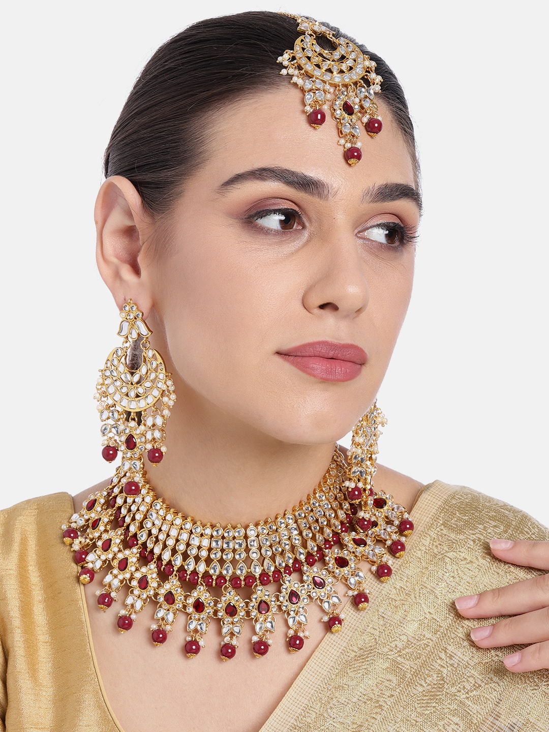 

Peora Gold-Plated Maroon Kundan Choker Necklace Earrings Maang Tikka Jewellery Set