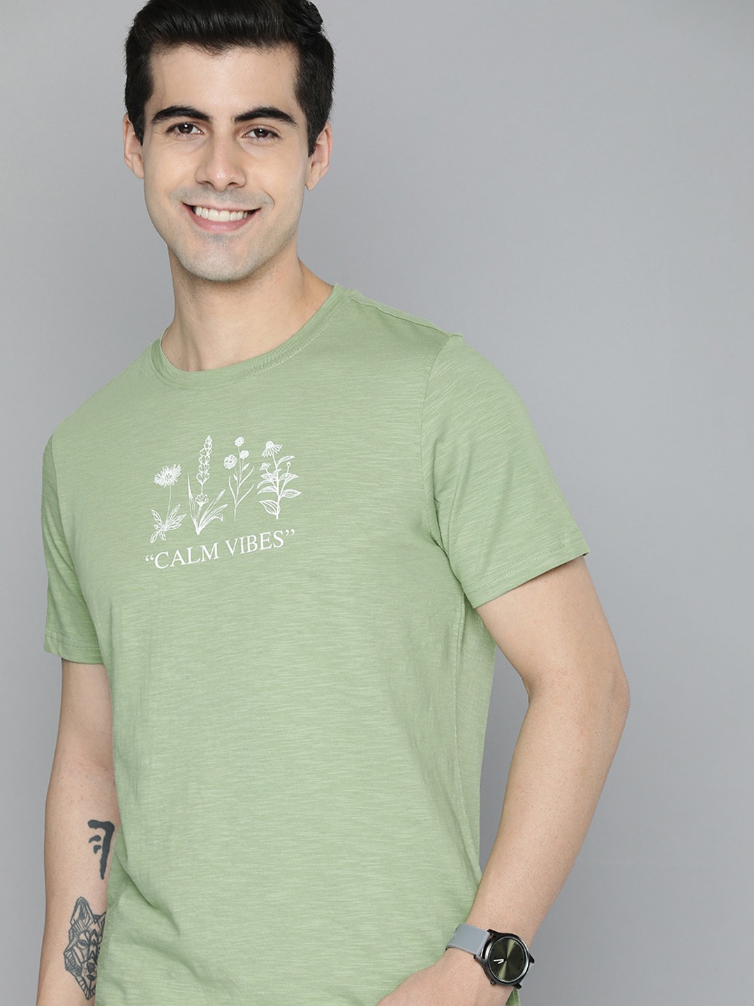

Mast & Harbour Men Green Typography Printed Pure Cotton T-shirt