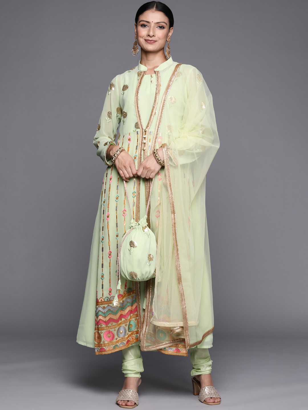 

Libas Women Green Solid Kurta Set with Embroidered Jacket & Potli
