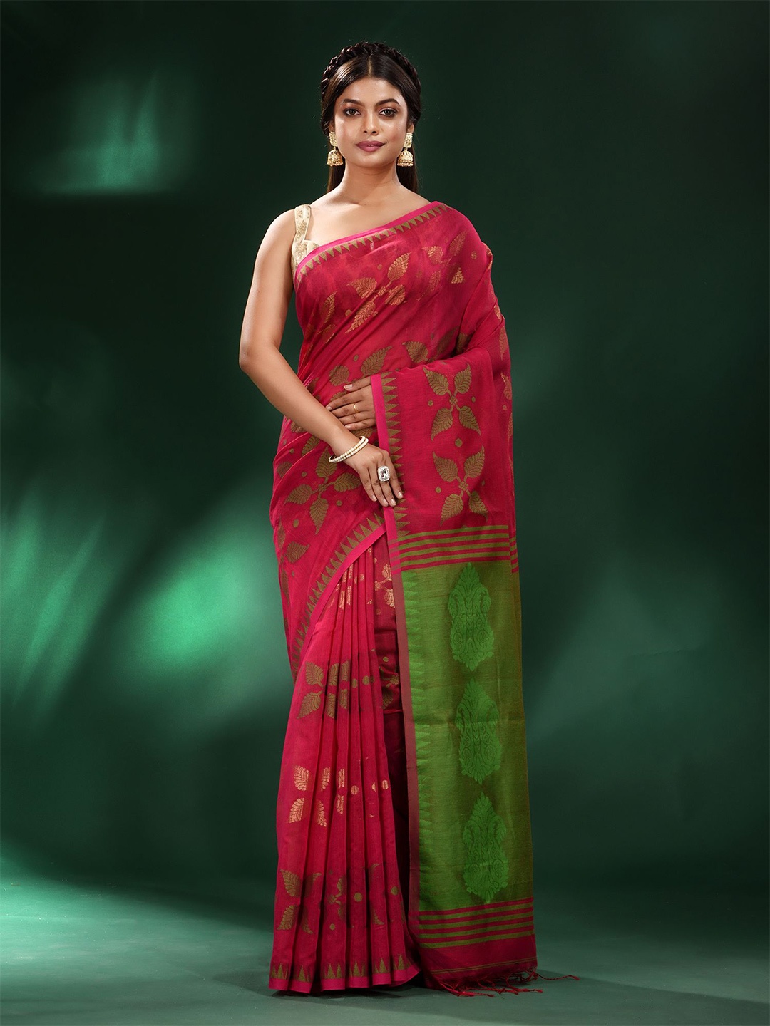 

Charukriti Red & Green Ethnic Motifs Saree