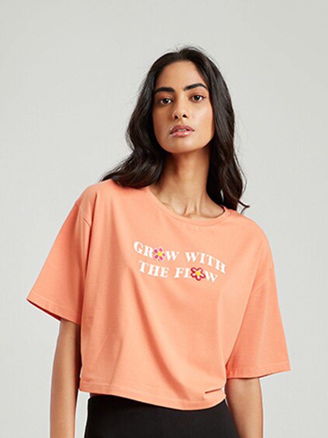 

COVER STORY Women Peach-Coloured Typography Printed Drop-Shoulder Sleeves T-shirt