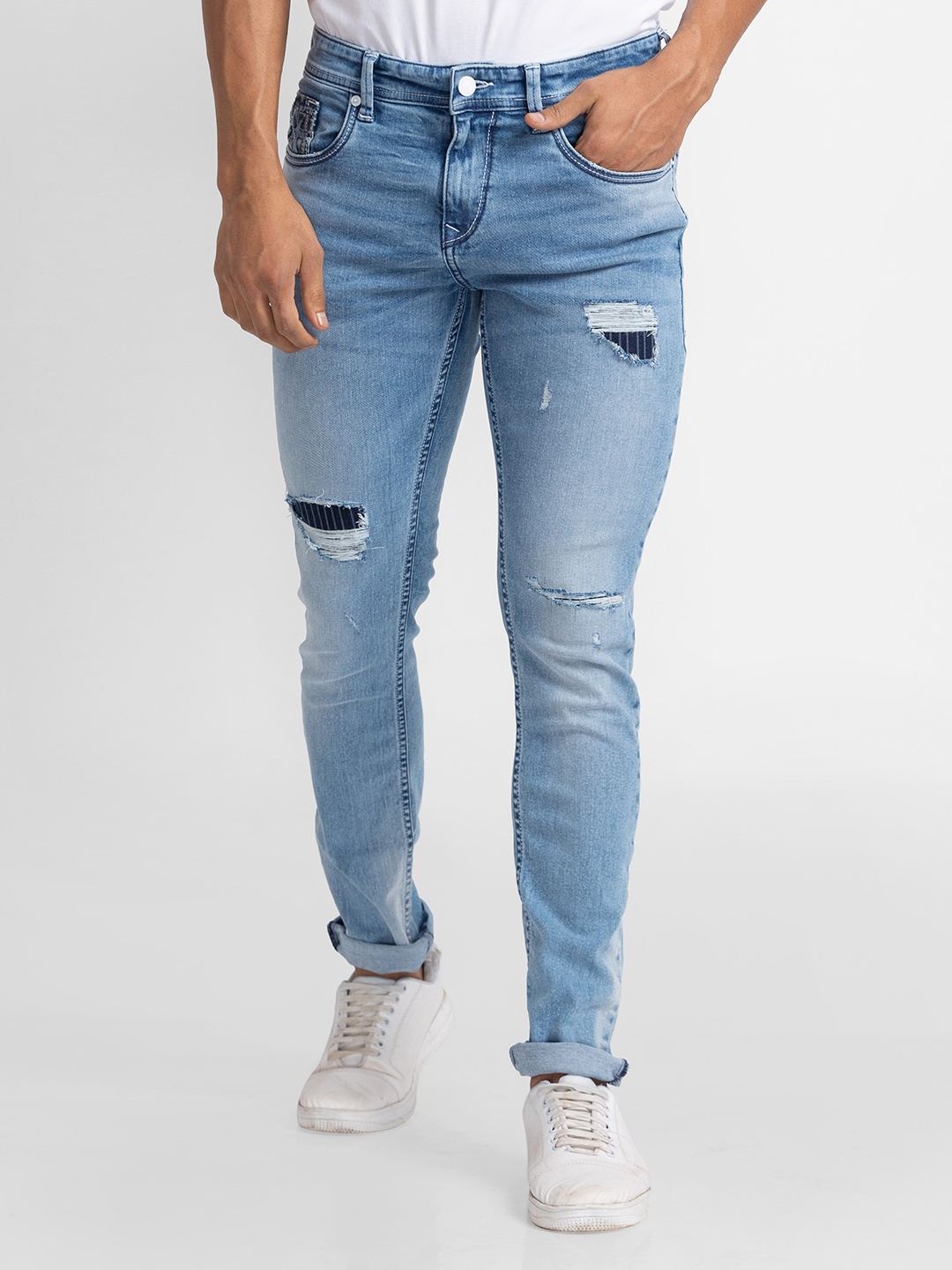 

SPYKAR Men Skinny Fit Low-Rise Mildly Distressed Light Fade Stretchable Jeans, Blue