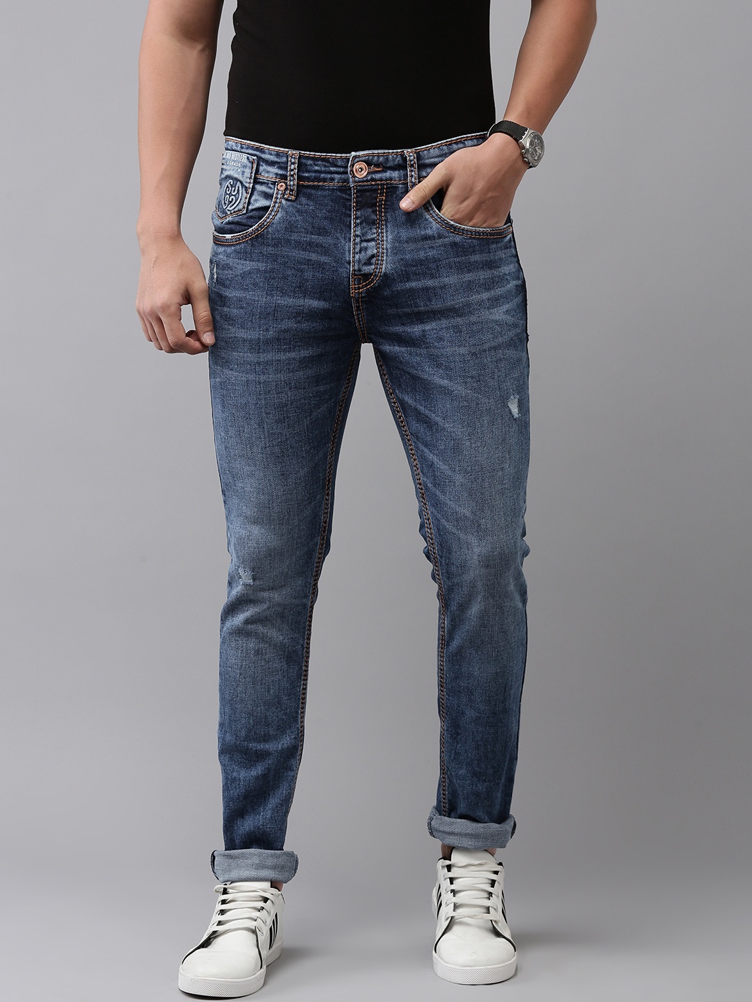 

SPYKAR Men Slim Fit Low-Rise Mildly Distressed Light Fade Stretchable Jeans, Blue