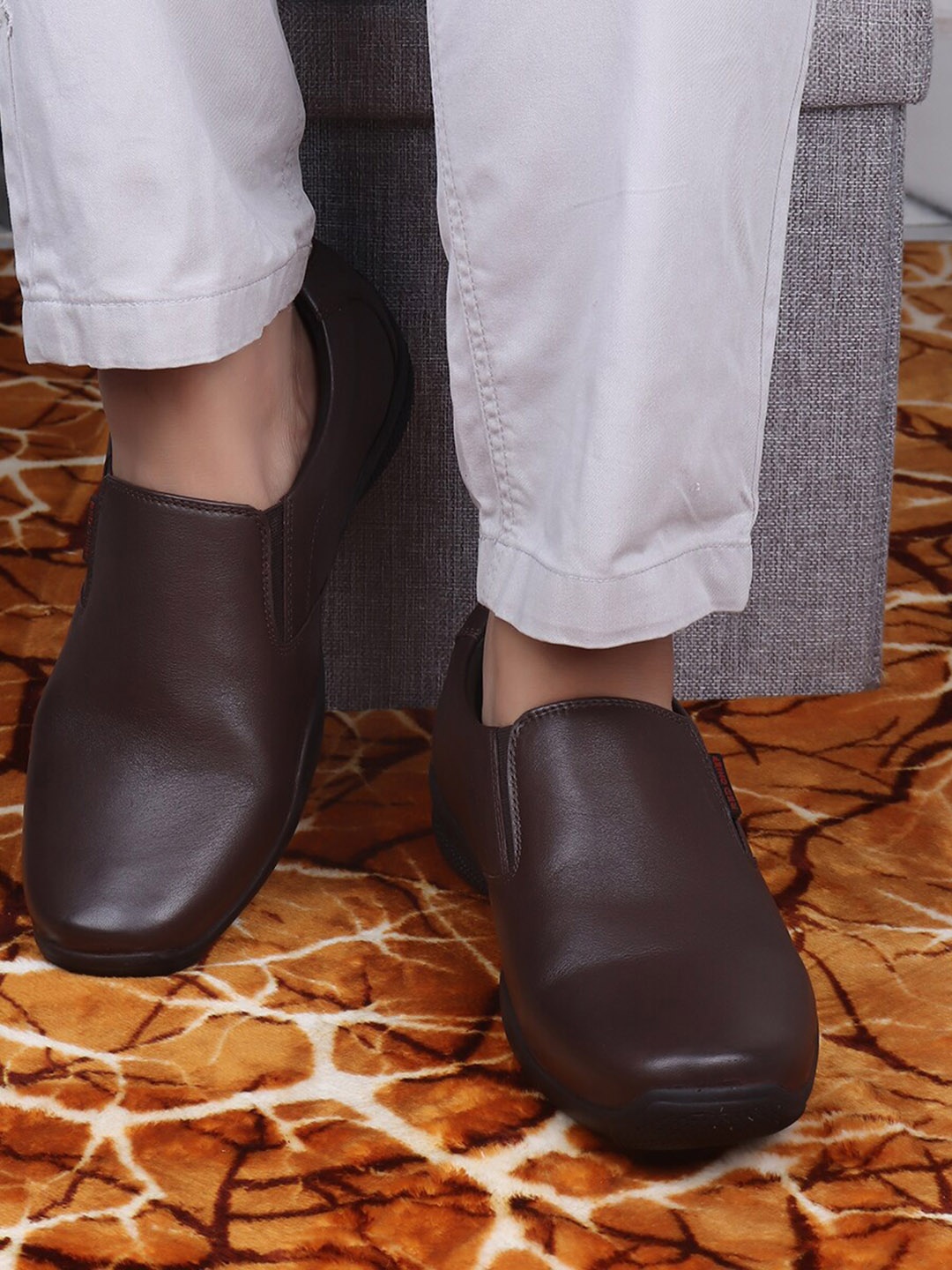 

Red Chief Men Brown Solid Leather Formal Slip-On Shoes