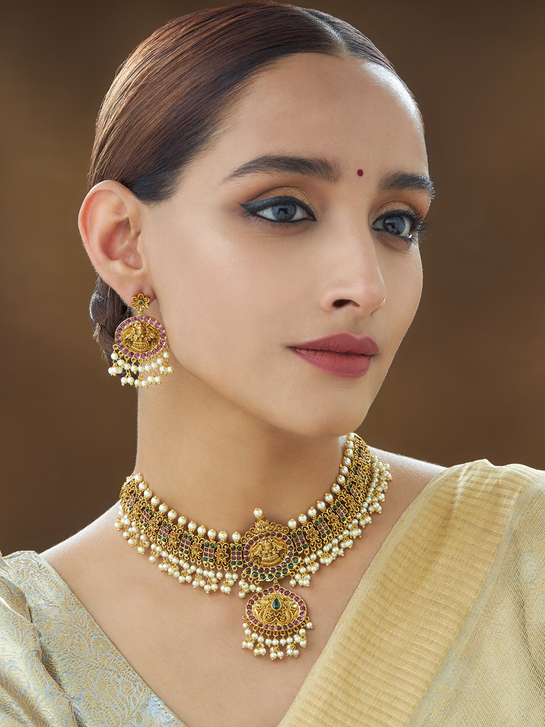 

Kushal's Fashion Jewellery Gold-Toned & Green Stone Studded & Beaded Antique Jewellery Set