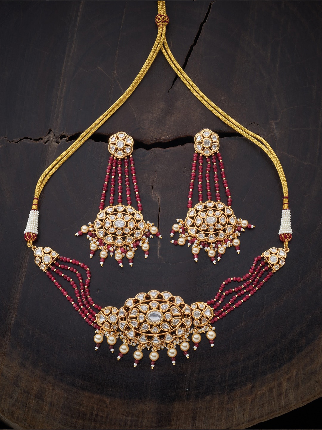 

Kushal's Fashion Jewellery Gold-Toned & Pink Kundan Studded Jewellery Set
