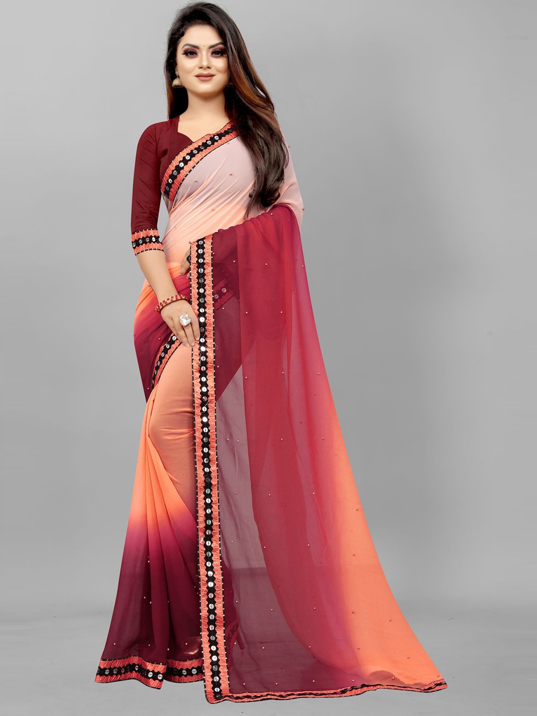 

Queenswear Creation Orange & Maroon Embellished Sequinned Pure Georgette Saree
