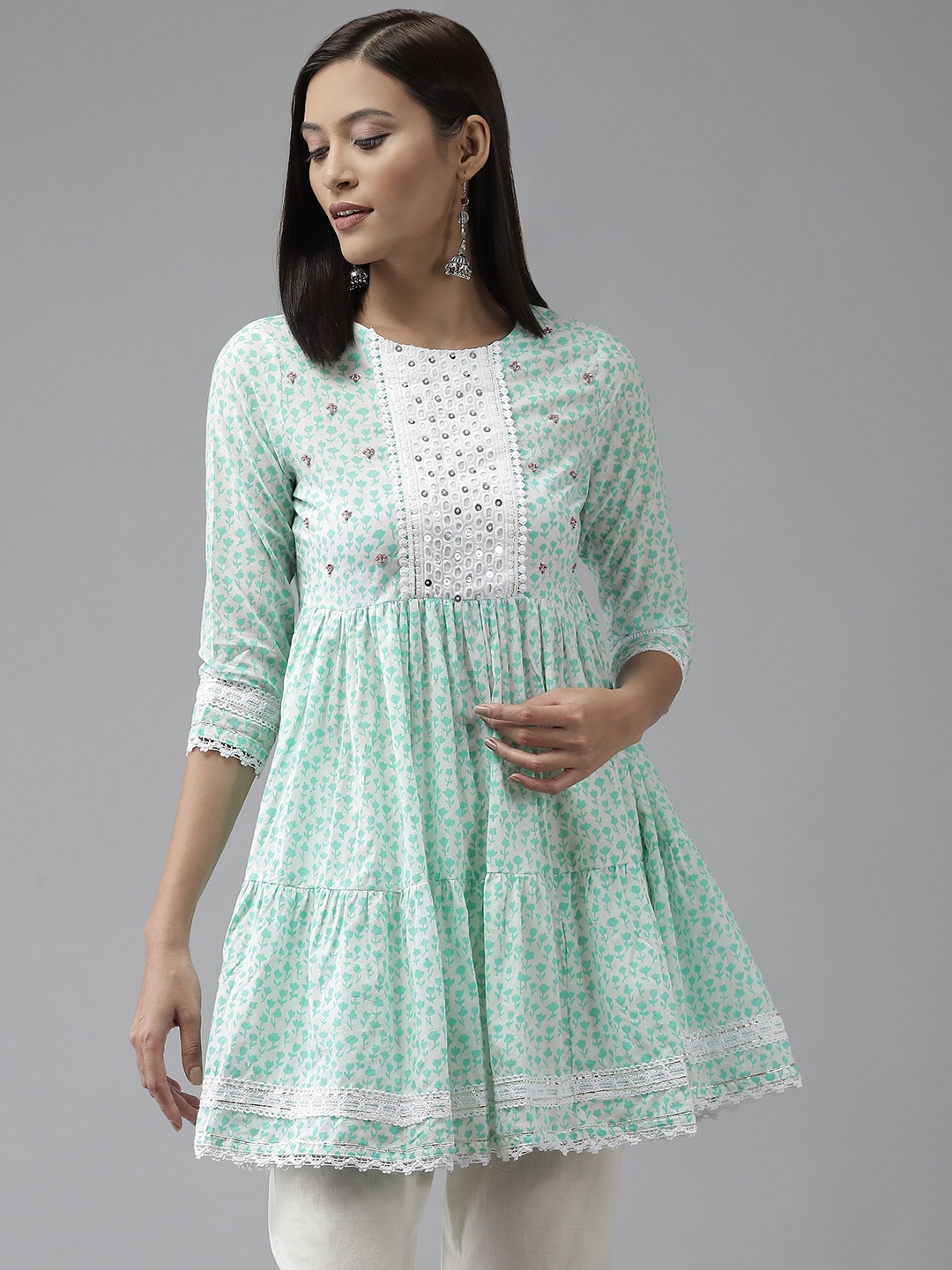 

Amirah s Sea Green & White Ethnic Motifs Printed Lace Inserts Pleated Pure Cotton Tunic