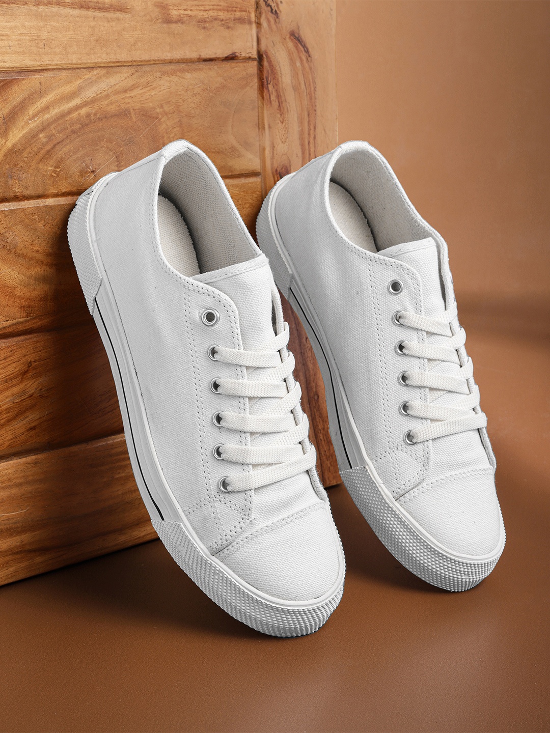 

Roadster Men White Solid Canvas Sneakers