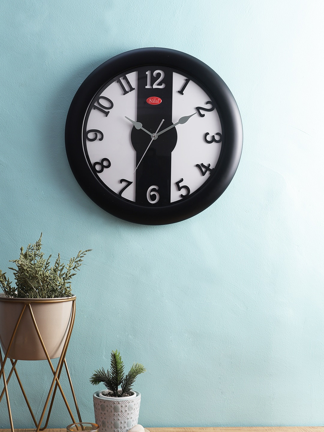 

Safal Black And White Wooden Artistic Laser Cut Numerals Wall Clocks