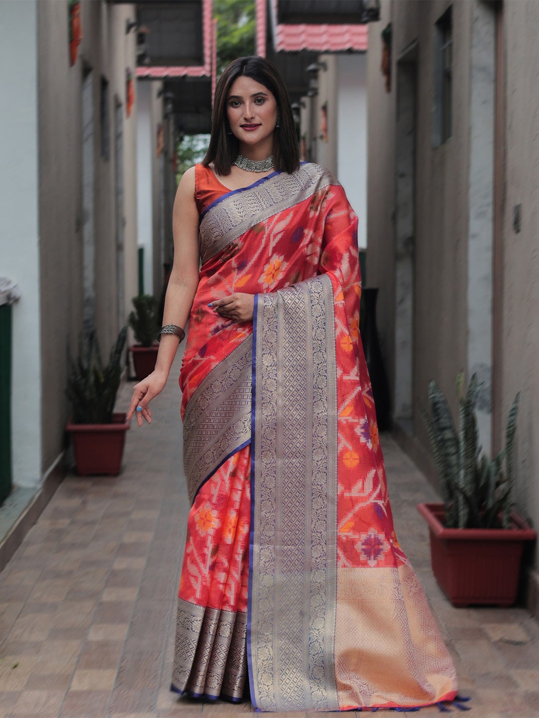 

Mitera Orange & Blue Floral Zari Organza Kanjeevaram Saree