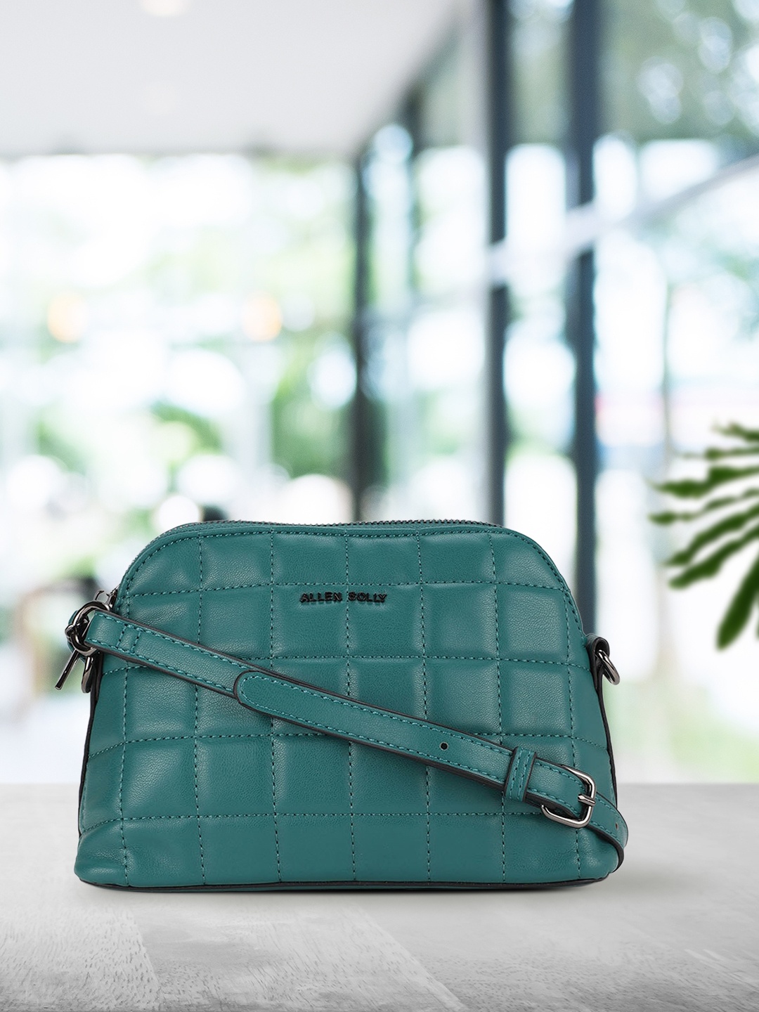 

Allen Solly Green Geometric Structured Sling Bag with Quilted