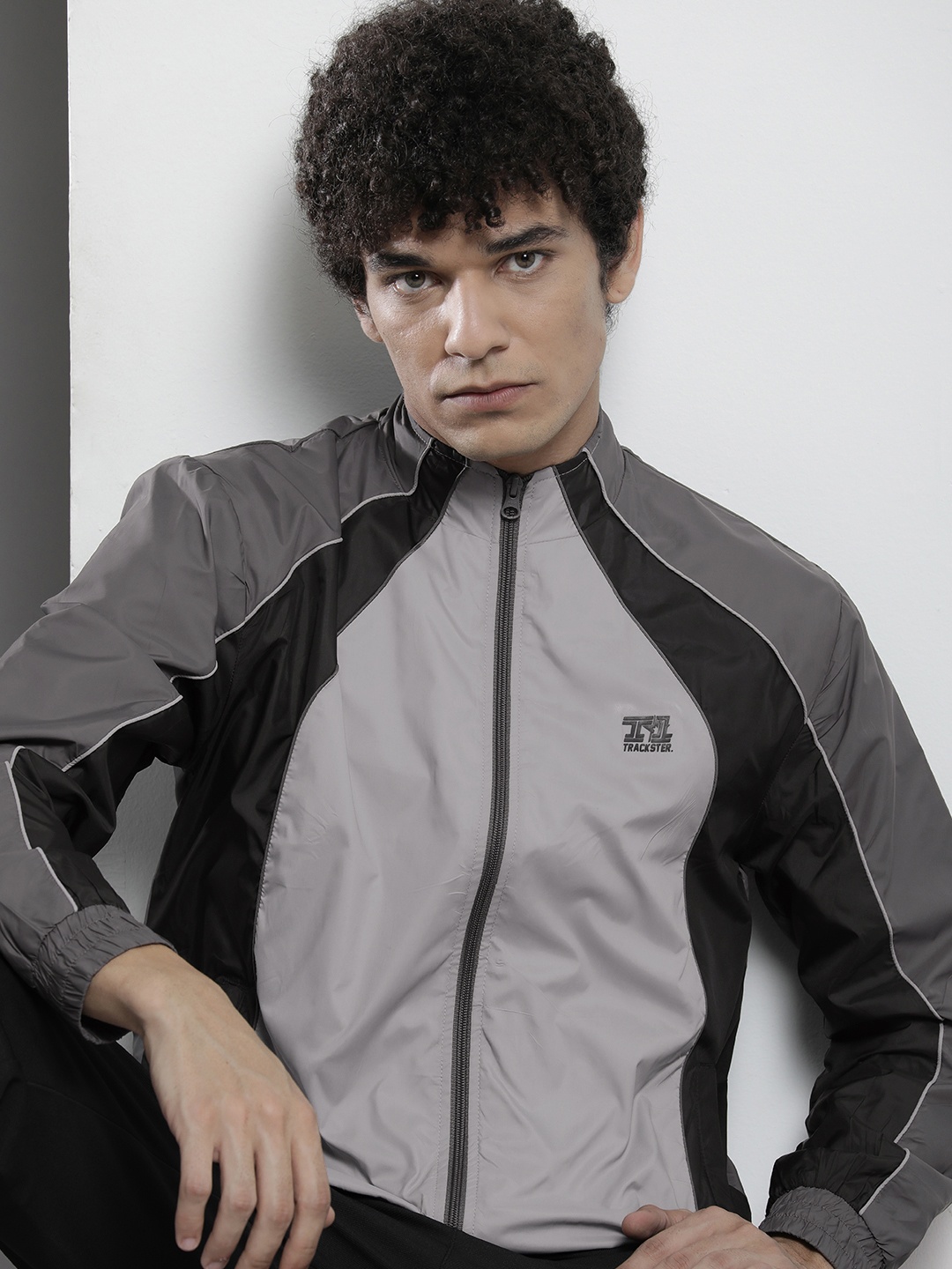 

The Indian Garage Co Men Grey & Black Colourblocked Windcheater Jacket