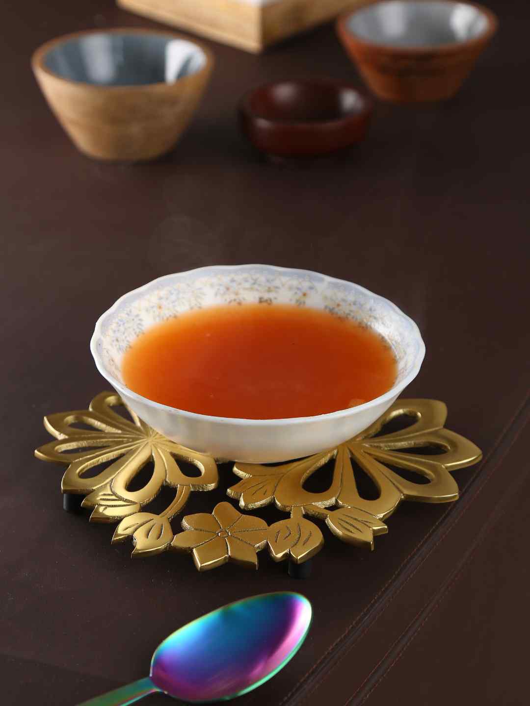 

Amoliconcepts Gold-Toned Matt Finish Flower Design Trivet