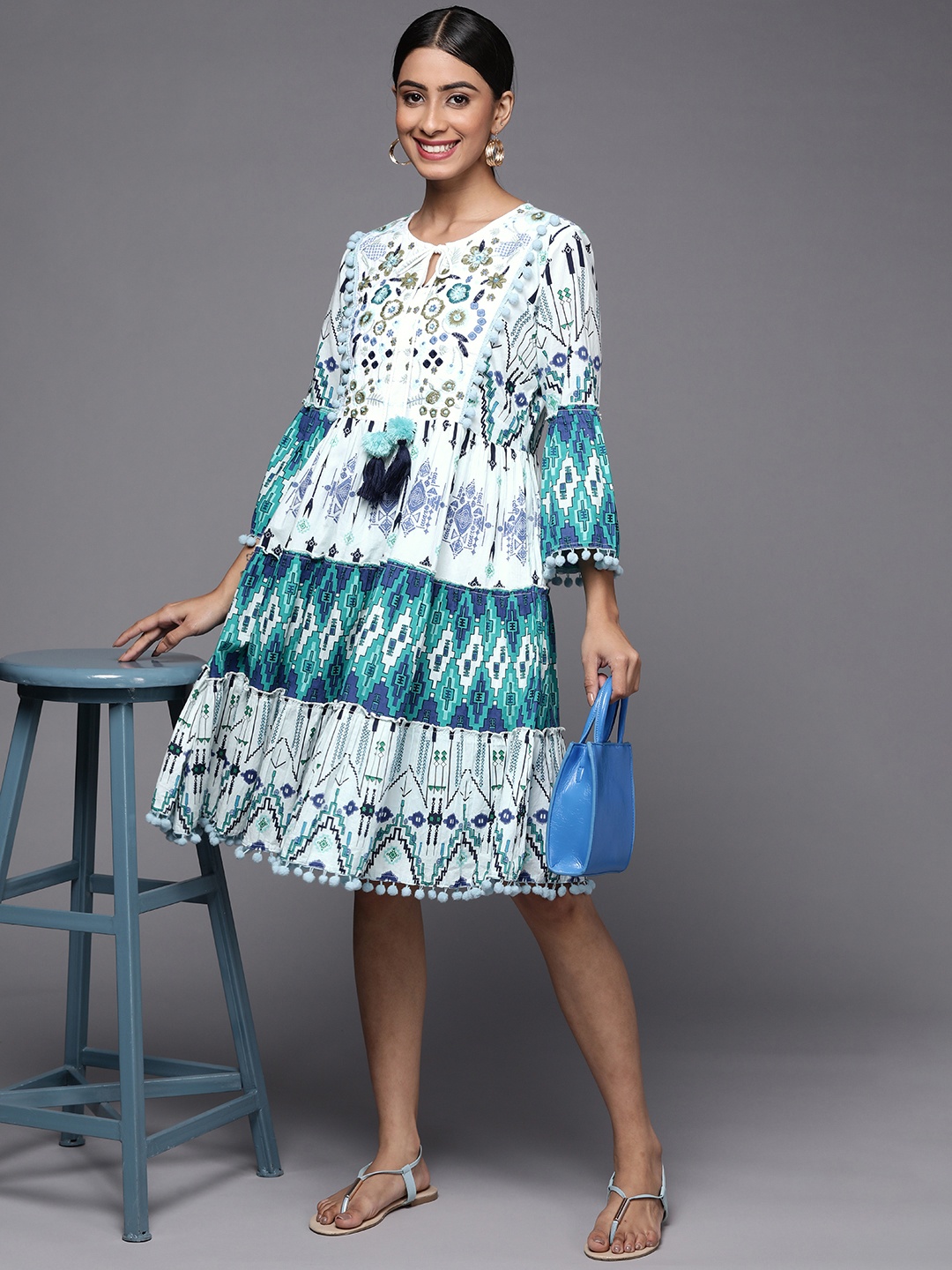 

Indo Era White & Teal Floral Embroidered Tie-Up Neck Ethnic A-Line Ethnic Dress