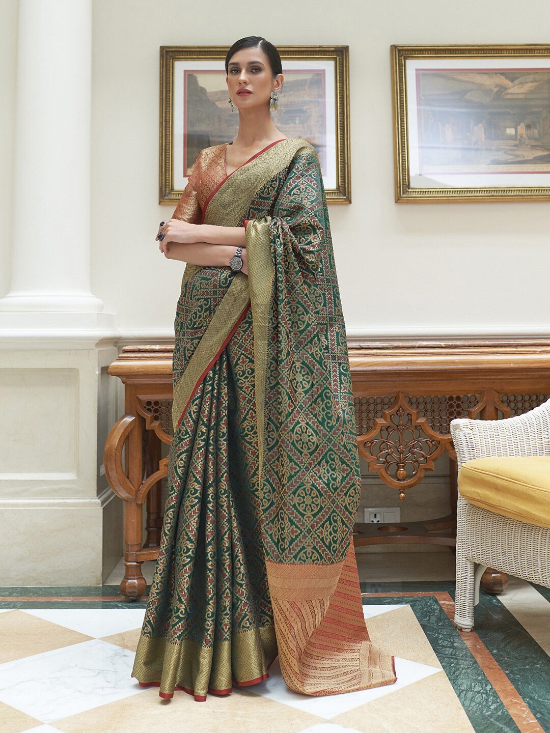 

Mitera Green & Red Floral Zari Silk Blend Patola Saree