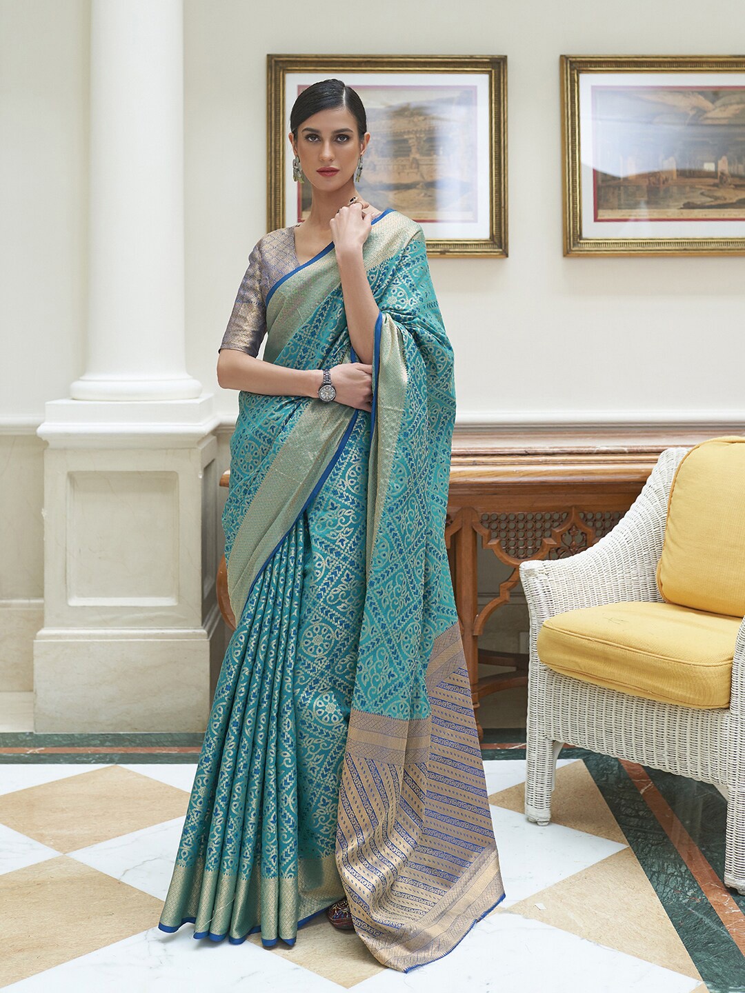 

Mitera Blue & Gold-Toned Ethnic Motifs Zari Silk Blend Patola Saree