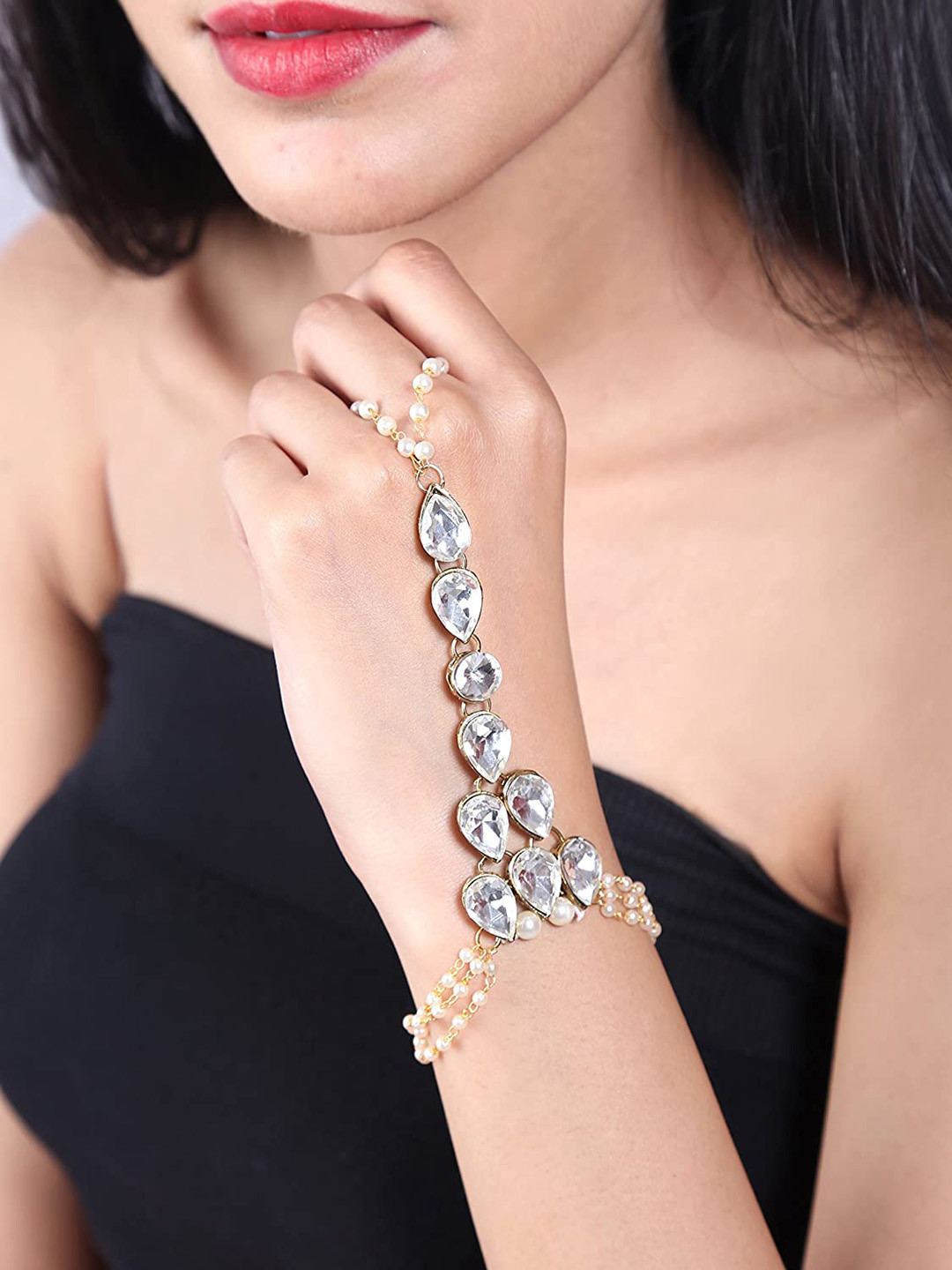 

Sanjog Women Gold-Toned & White Brass Kundan Antique Gold-Plated Ring Bracelet
