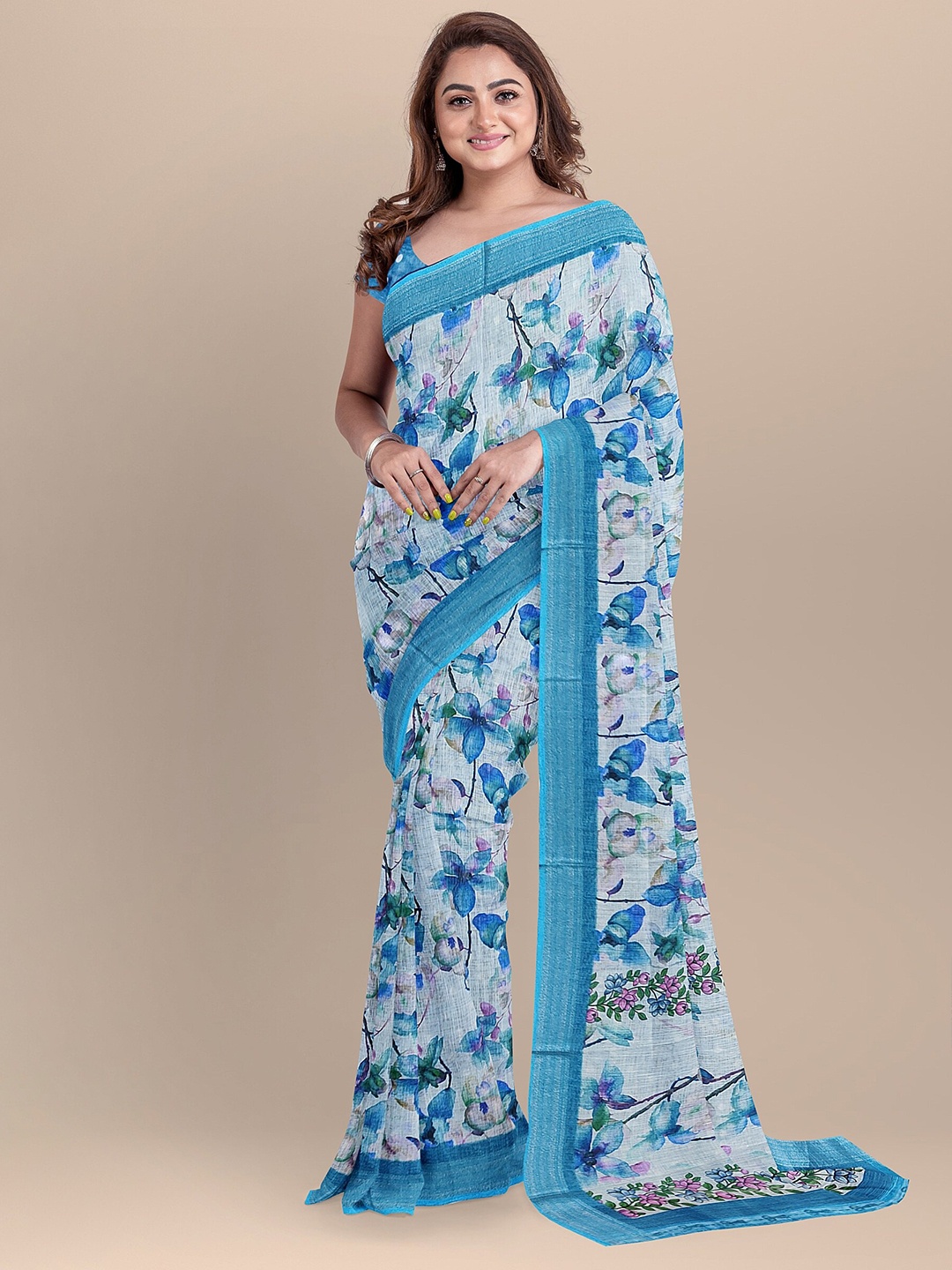 

The Chennai Silks Blue & White Floral Zari Linen Blend Saree