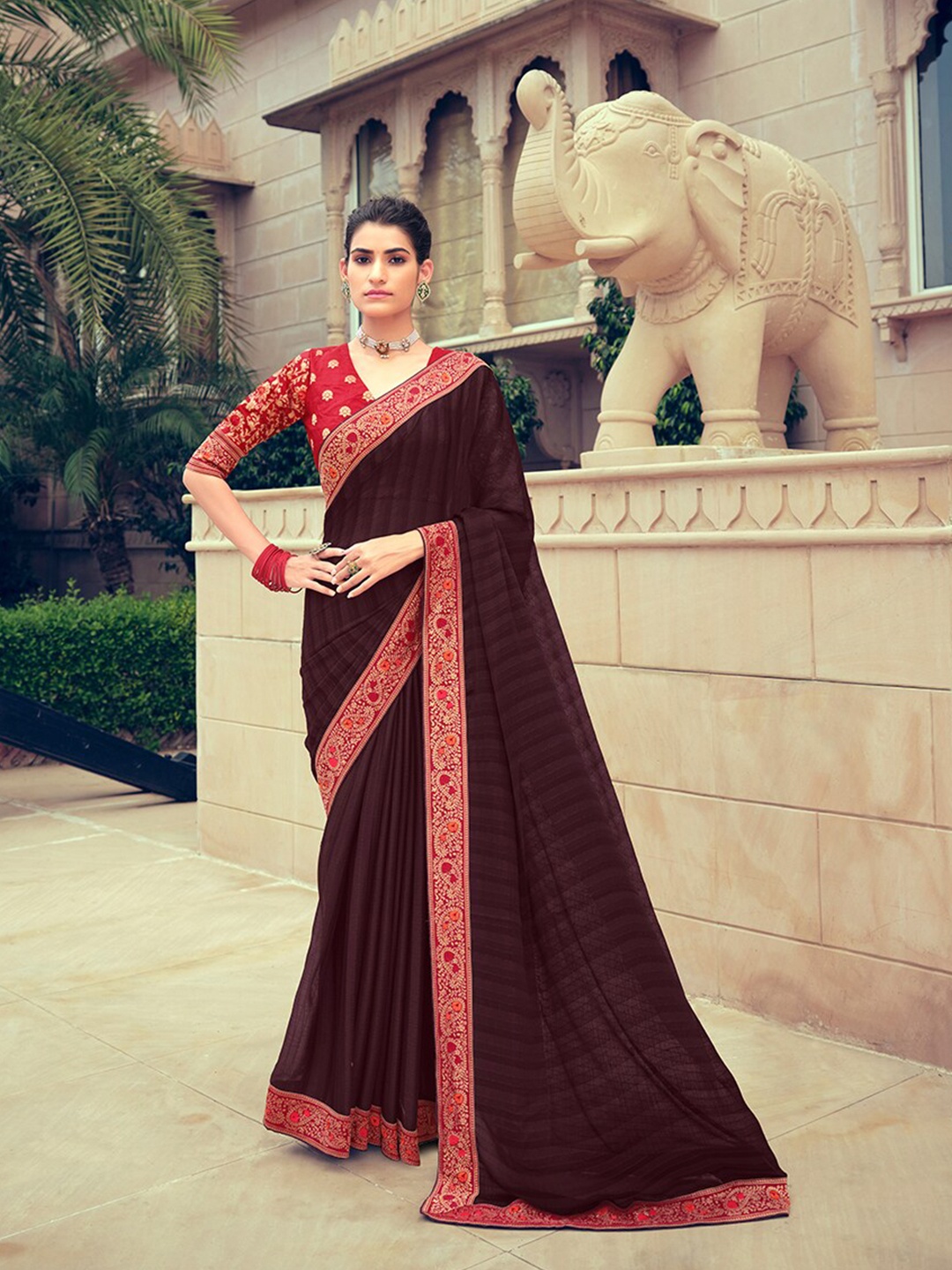 

Shaily Burgundy Self Design Striped Zari Woven Design Border Pure Chiffon Saree