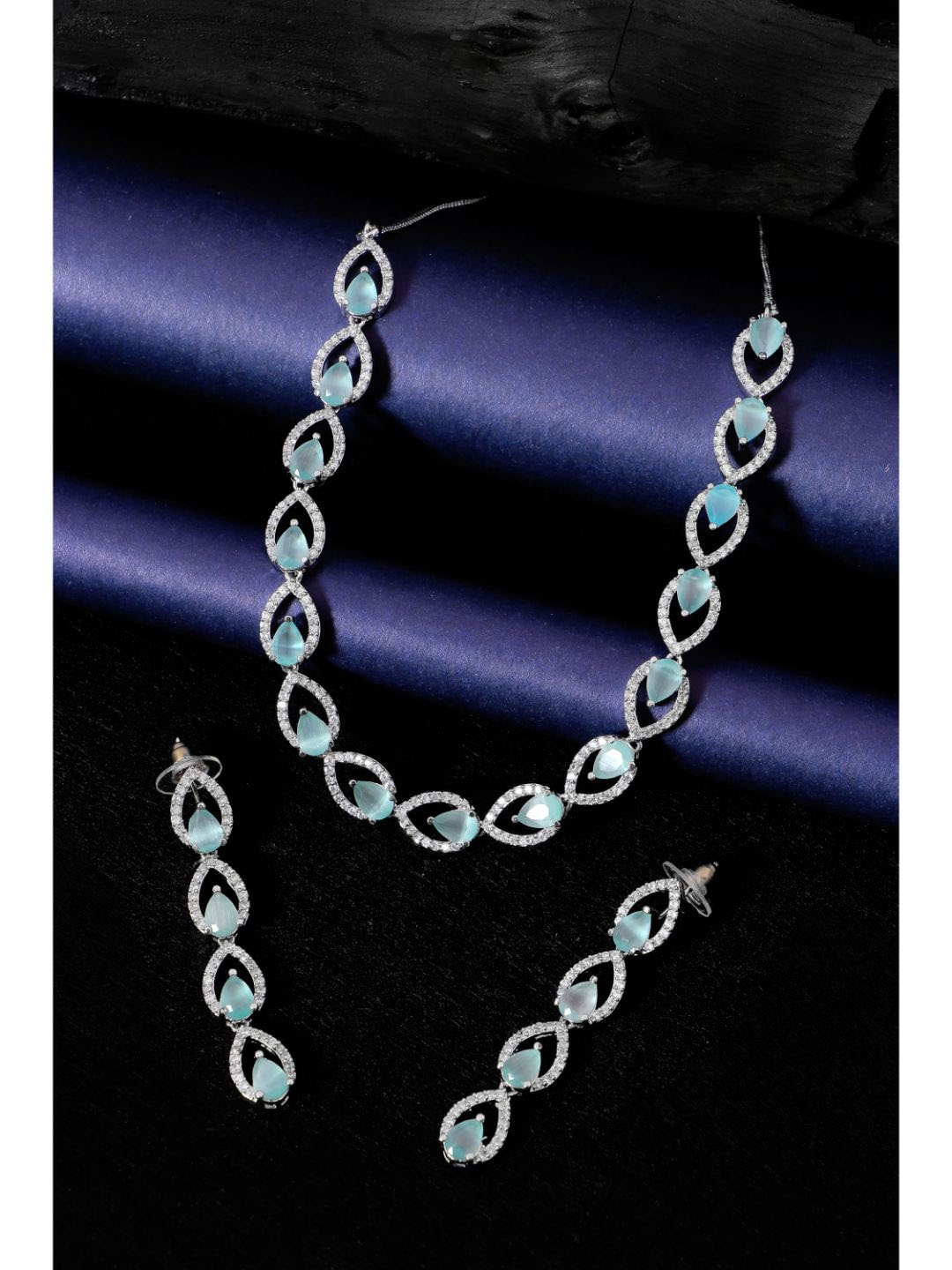 

SwaDev Silver-Plated Turquoise Blue AD Stone Studded Jewellery Set