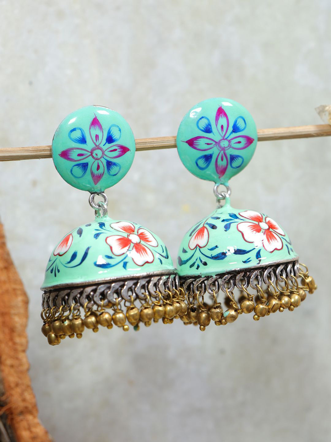 

SwaDev Blue & White Silver-Plated Hand Painted Jhumkas Earrings