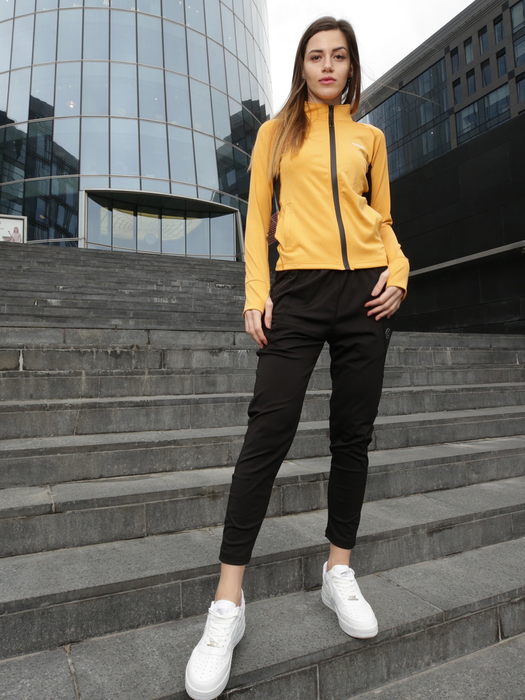 

CHKOKKO Women Mustard & Black Solid Tracksuits
