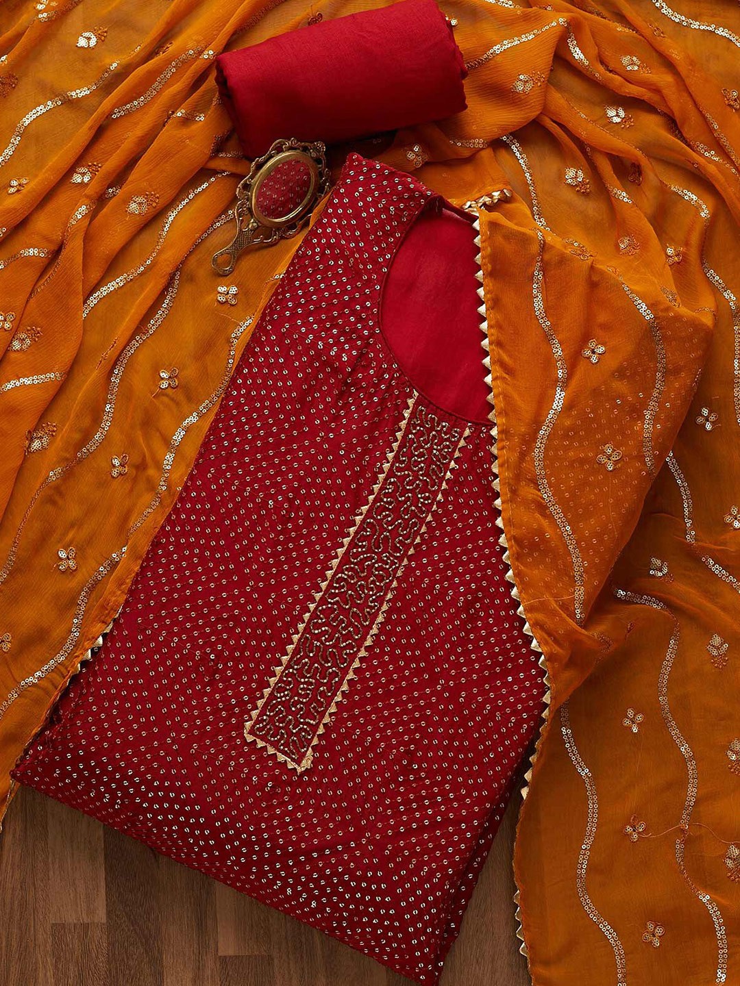

Koskii Maroon & Orange Embroidered Unstitched Dress Material
