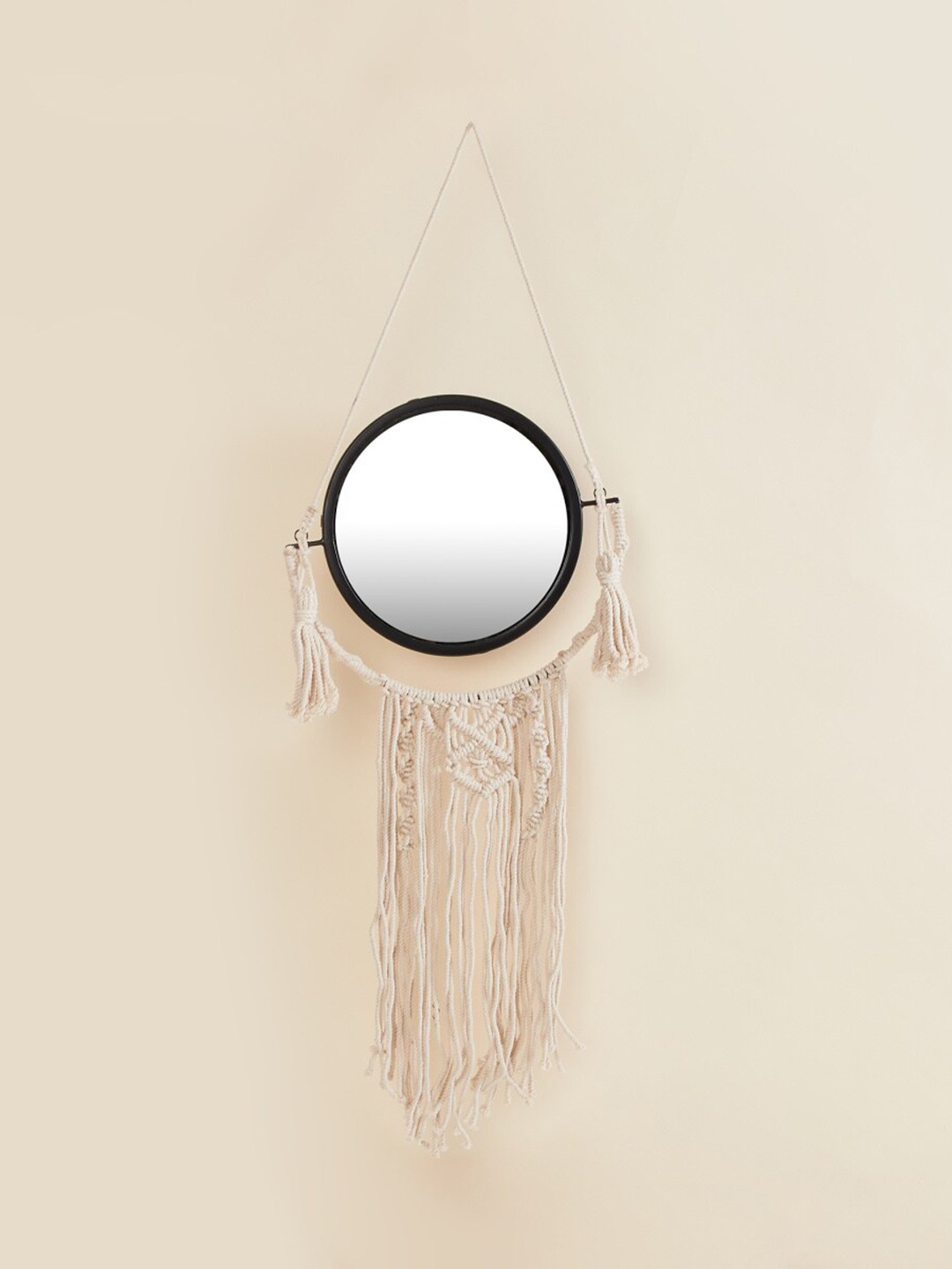 

Home Centre Beige Round Mirror with Hanging Tassels