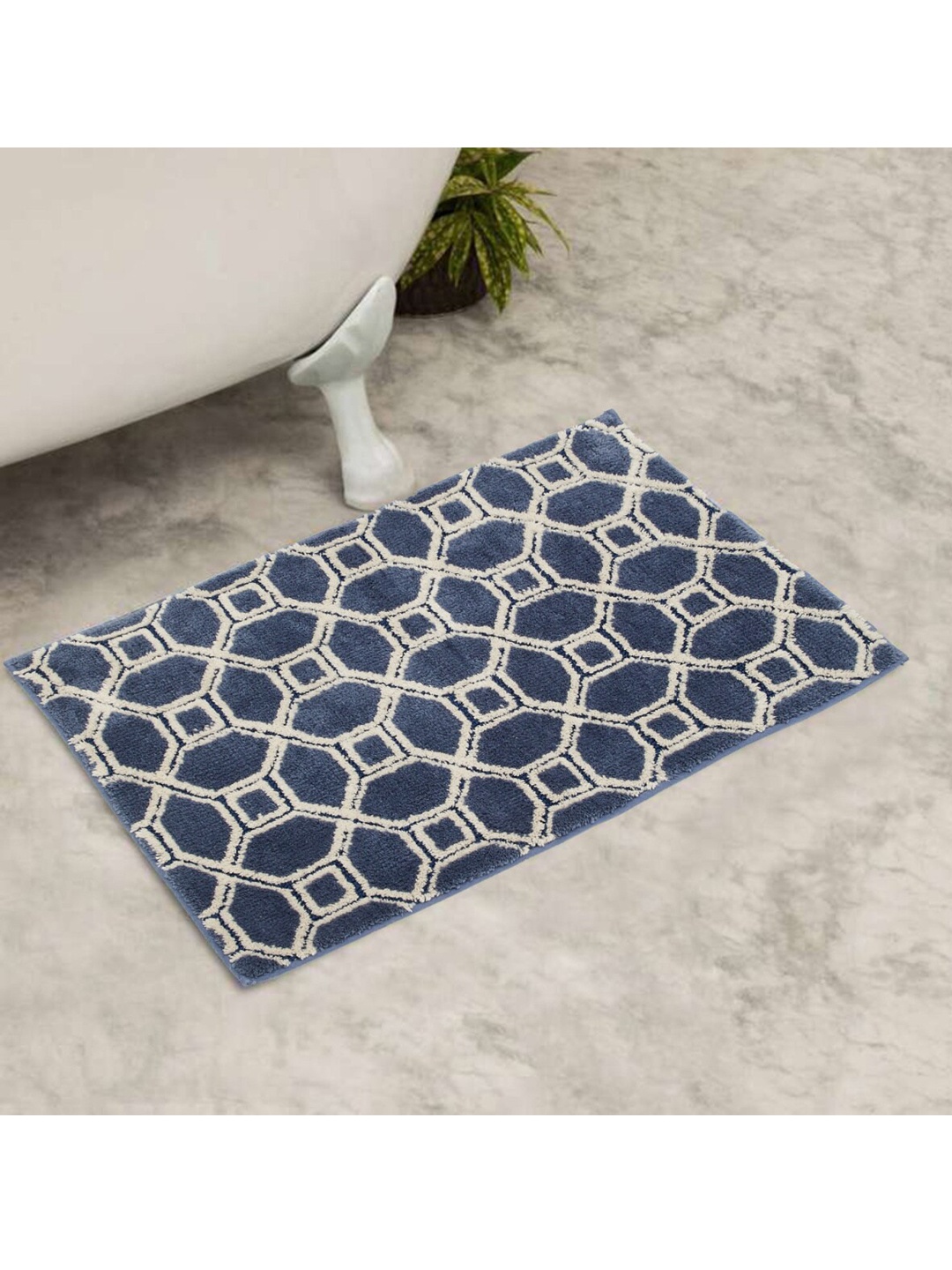 

Home Centre Blue Geometric Woven Design 150 GSM Anti-Slip Bath Rug