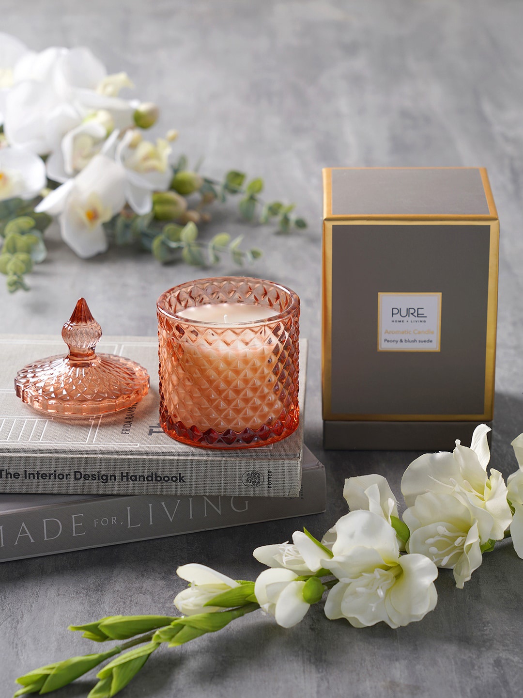 

Pure Home and Living Orange-Colored Ribbed Design Candle