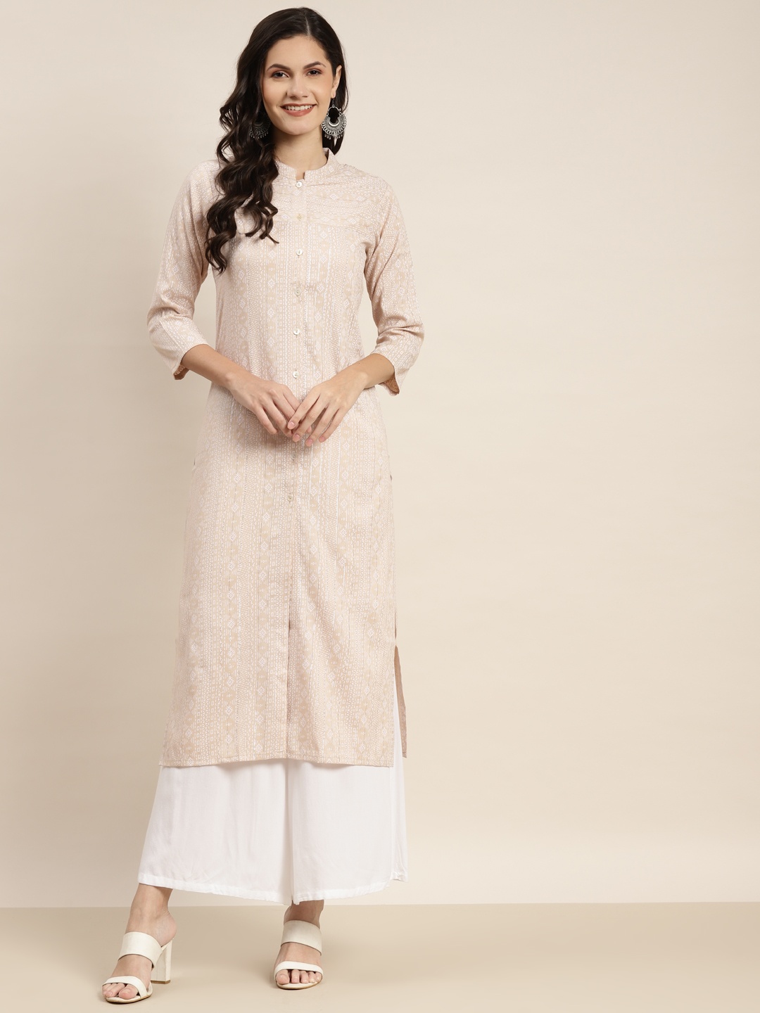 

Jompers Women Brown & Off White Ethnic Motifs Printed Lurex Kurta