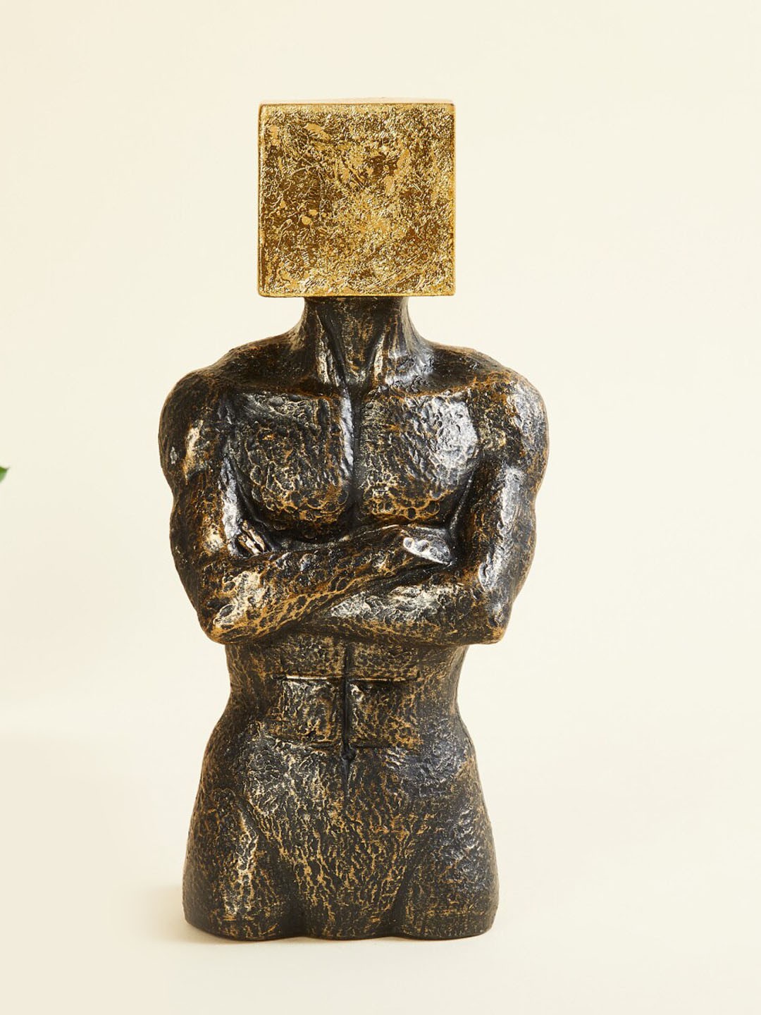 

Home Centre Gold Toned Man with Square on Top Figurine Showpieces