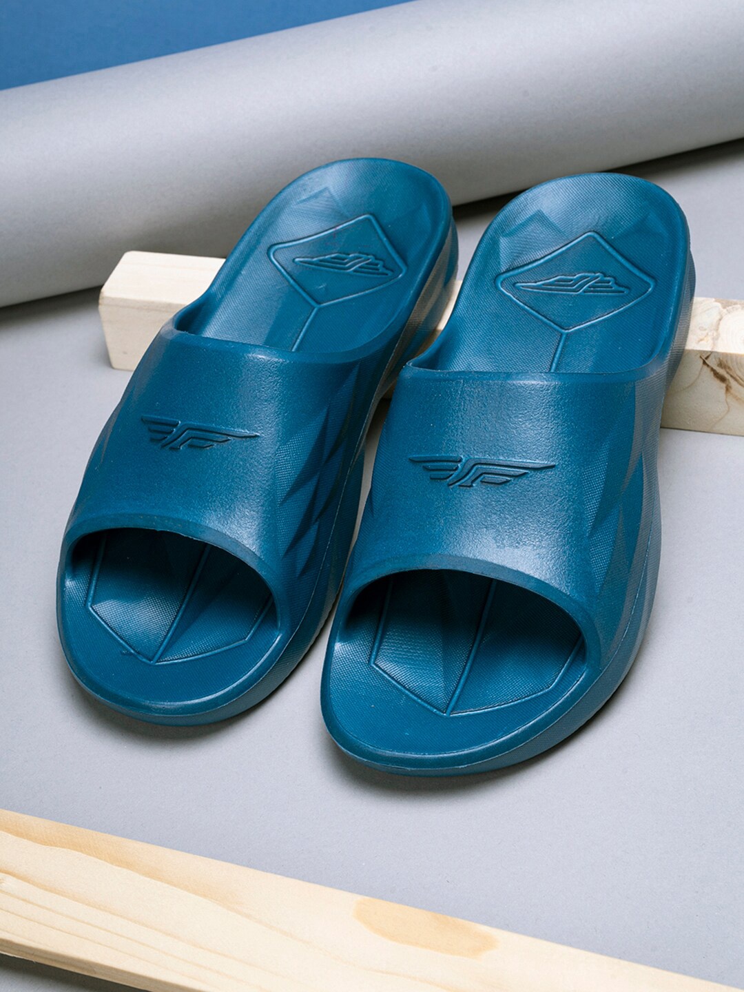 

Red Tape Women Blue Solid Rubber Sliders