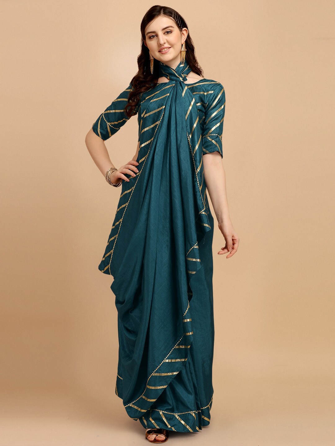 

Fab Viva Turquoise Blue & Gold-Toned Leheriya Saree