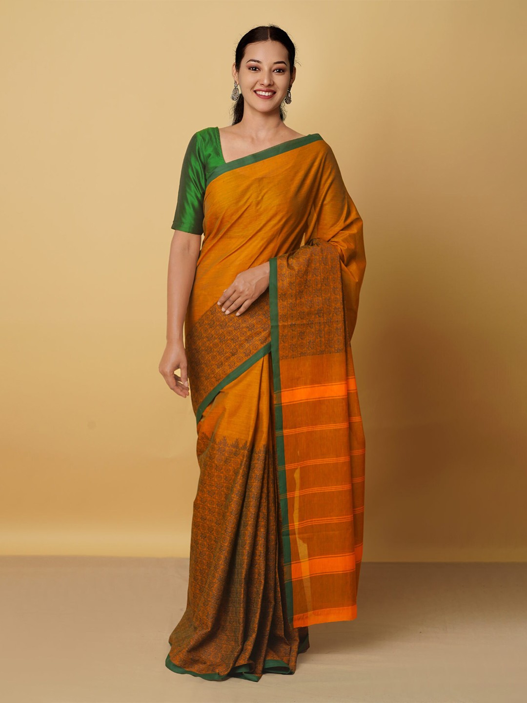 

Unnati Silks Orange & Green Ethnic Motifs Zari Pure Cotton Kanjeevaram Saree