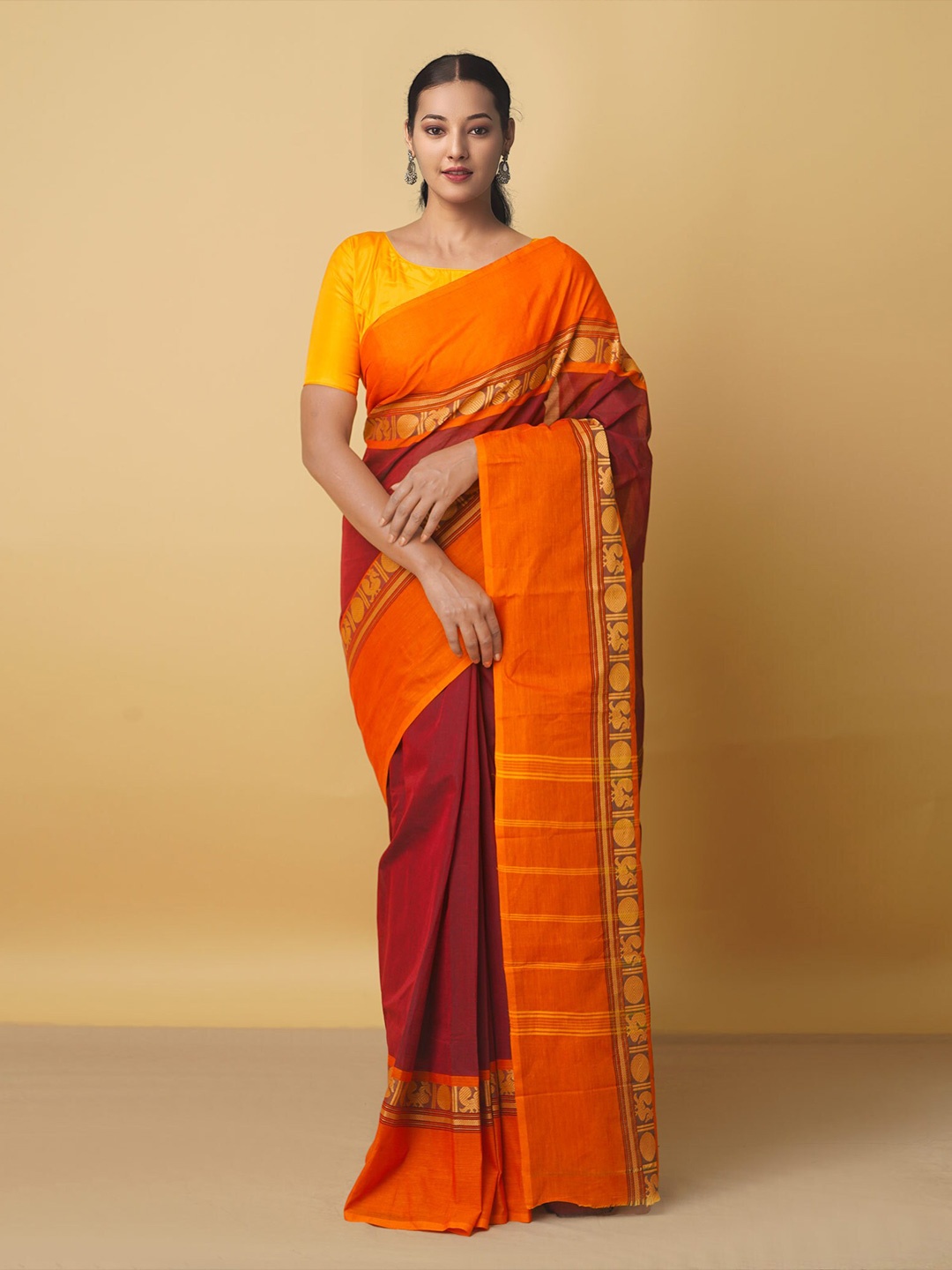 

Unnati Silks Maroon & Orange Ethnic Motifs Zari Pure Cotton Kanjeevaram Saree