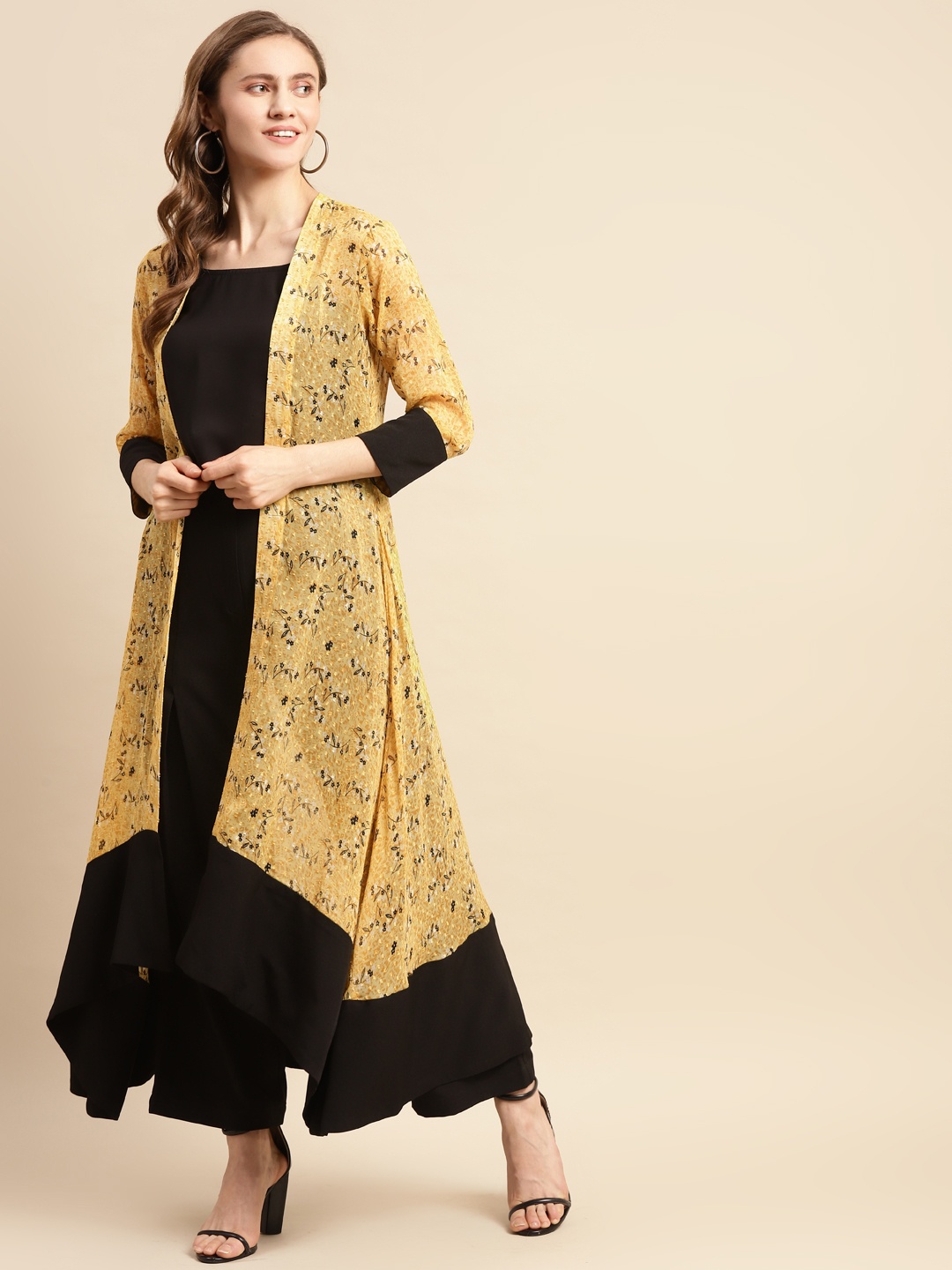 

WoowZerz Women Yellow & Black Poly Chiffon Printed Longline Shrug