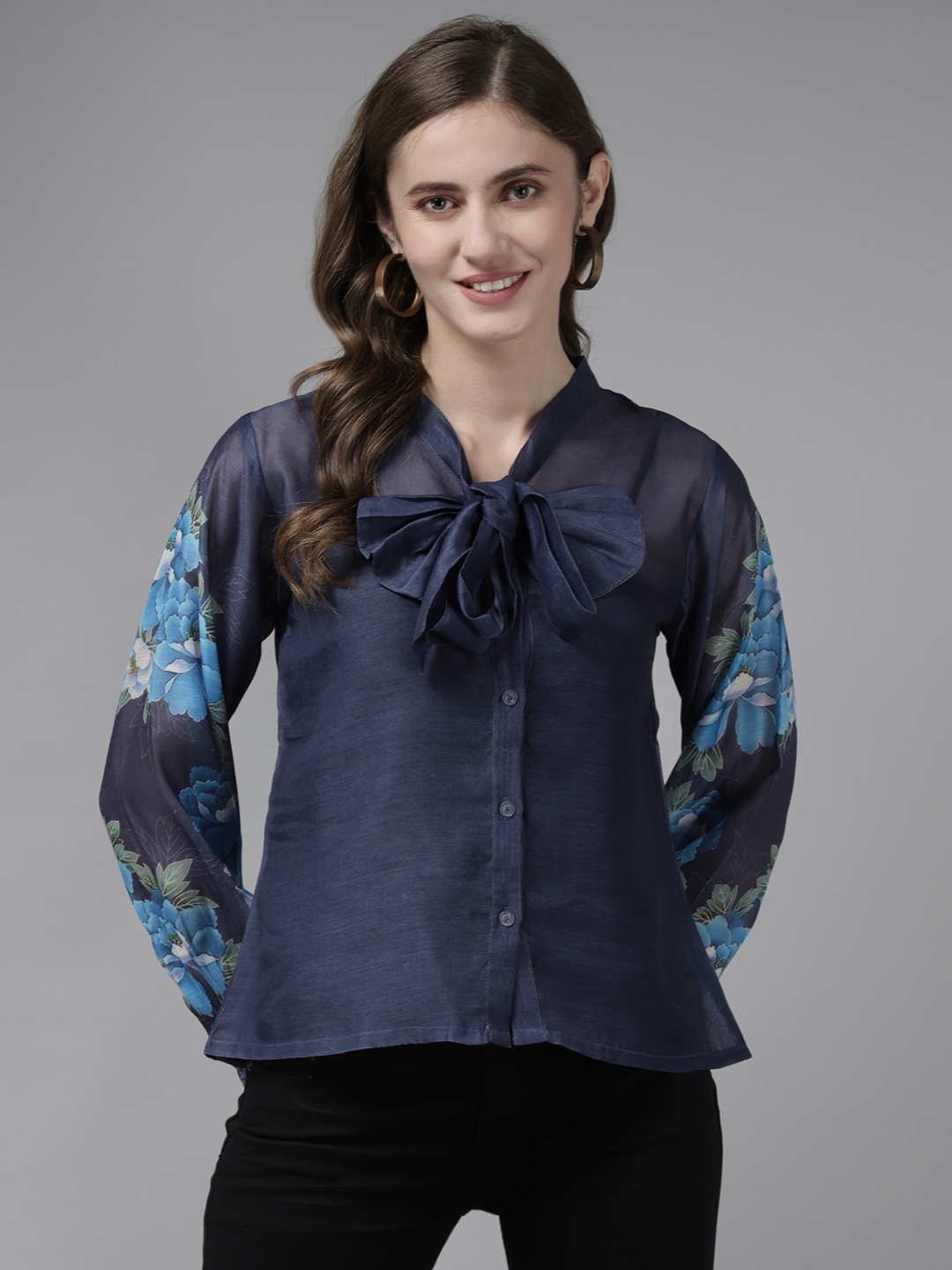 

Bhama Couture Navy Blue Floral Print Tie-Up Neck Shirt Style Top