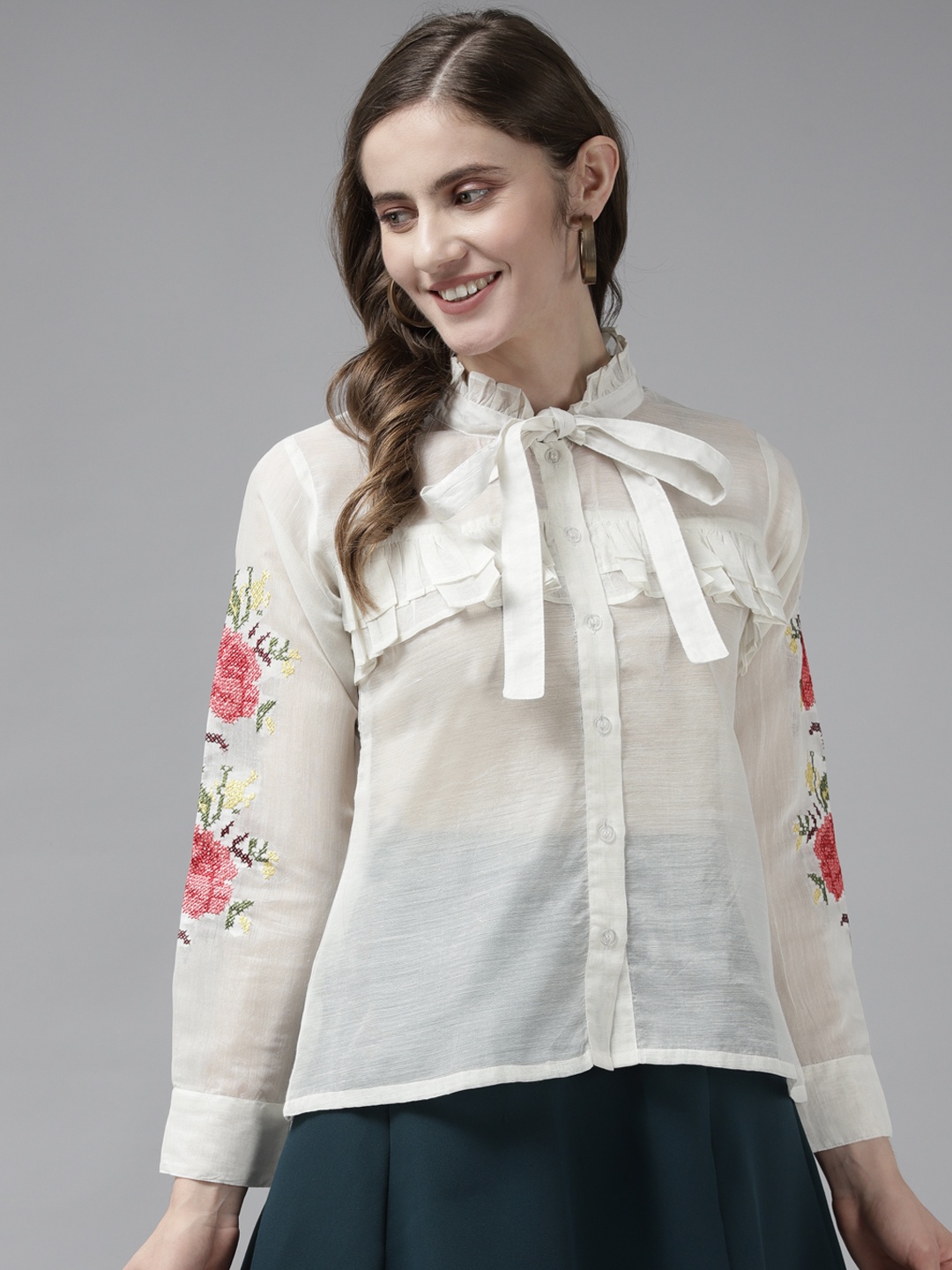 

Bhama Couture Off White Embroidered Tie-Up Neck Ruffles Shirt Style Top