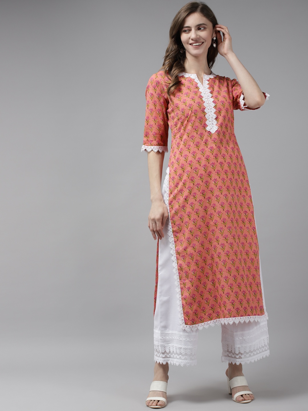 

Bhama Couture Women Orange Floral Printed Kurta with Palazzos