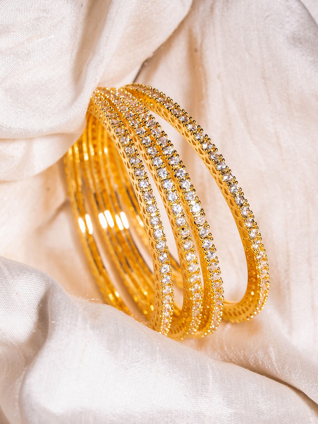 

Nathany Jewels Pack Of 4 Gold-Plated White AD Studded Bangles