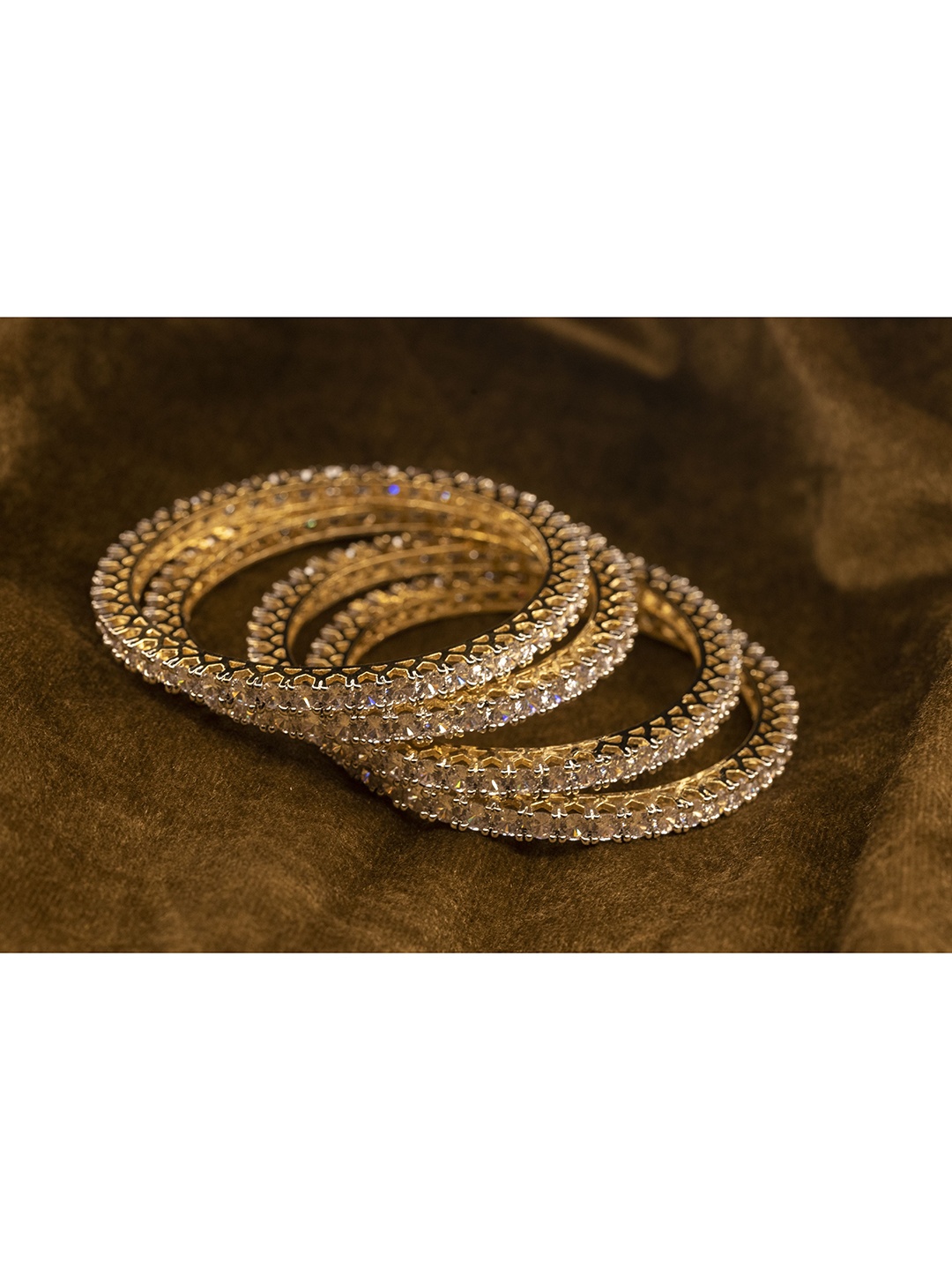 

Nathany Jewels Pack Of 4 Gold-Plated Gold-Toned White CZ/AD Studded Bangles