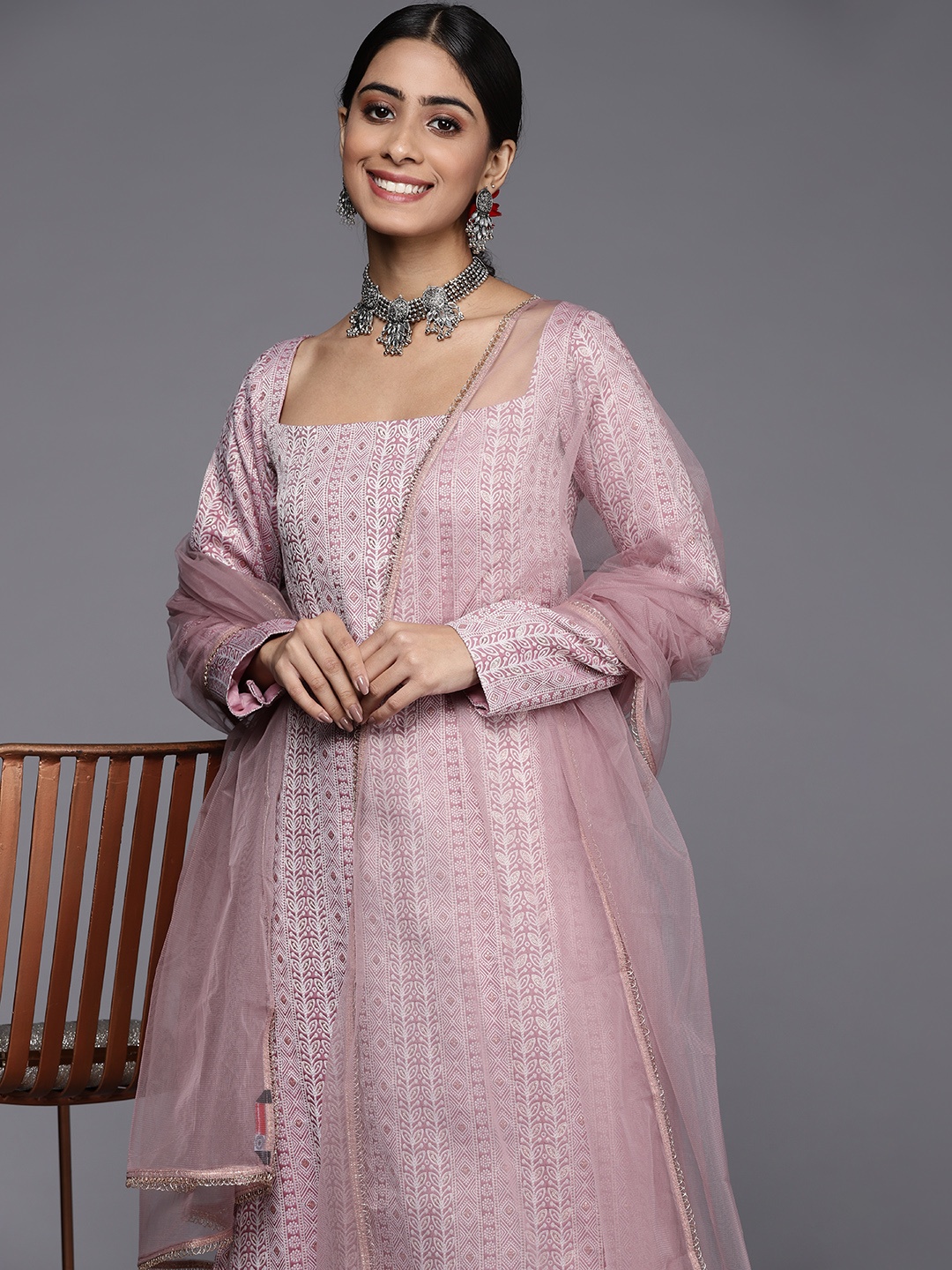 

Inddus Women Pink Tribal Embroidered Thread Work Kurta with Trousers & With Dupatta